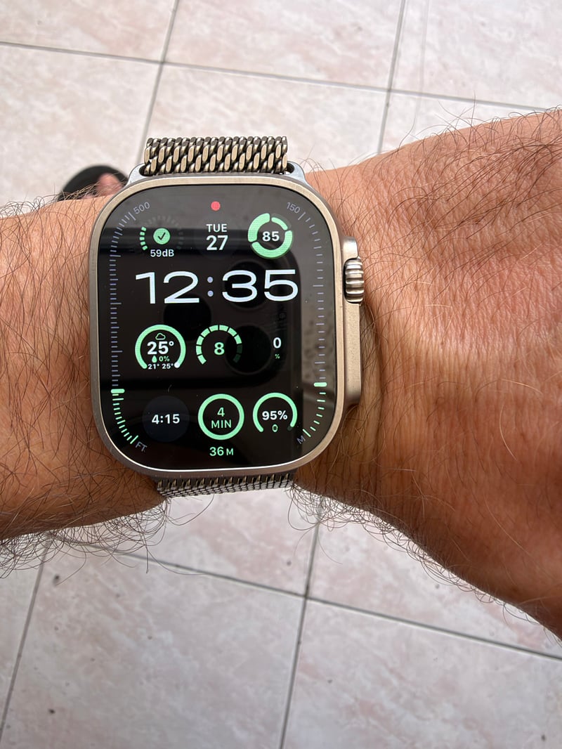 Apple Watch Ultra on a wrist with the Modular Ultra face showing Horef Rings complications for temperature with rain chance and a Headroom score of 8