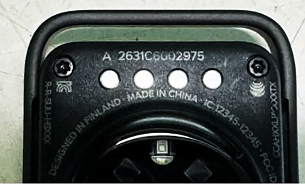 Underside of the Suunto HR264 band pod showing the optical heart rate sensor, strap lugs and certification label