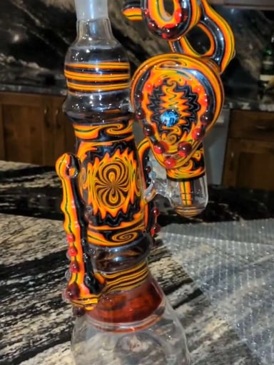 Preview pic of Hedman Headies Dab Rig, black and orange with signature milli for style and authenticity. 