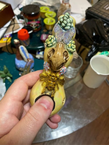 Preview pic of Diverse earth ceramic spoon 1/1 has 24k gold bee and a wooden carved cat skull and a iridescent butterfly  