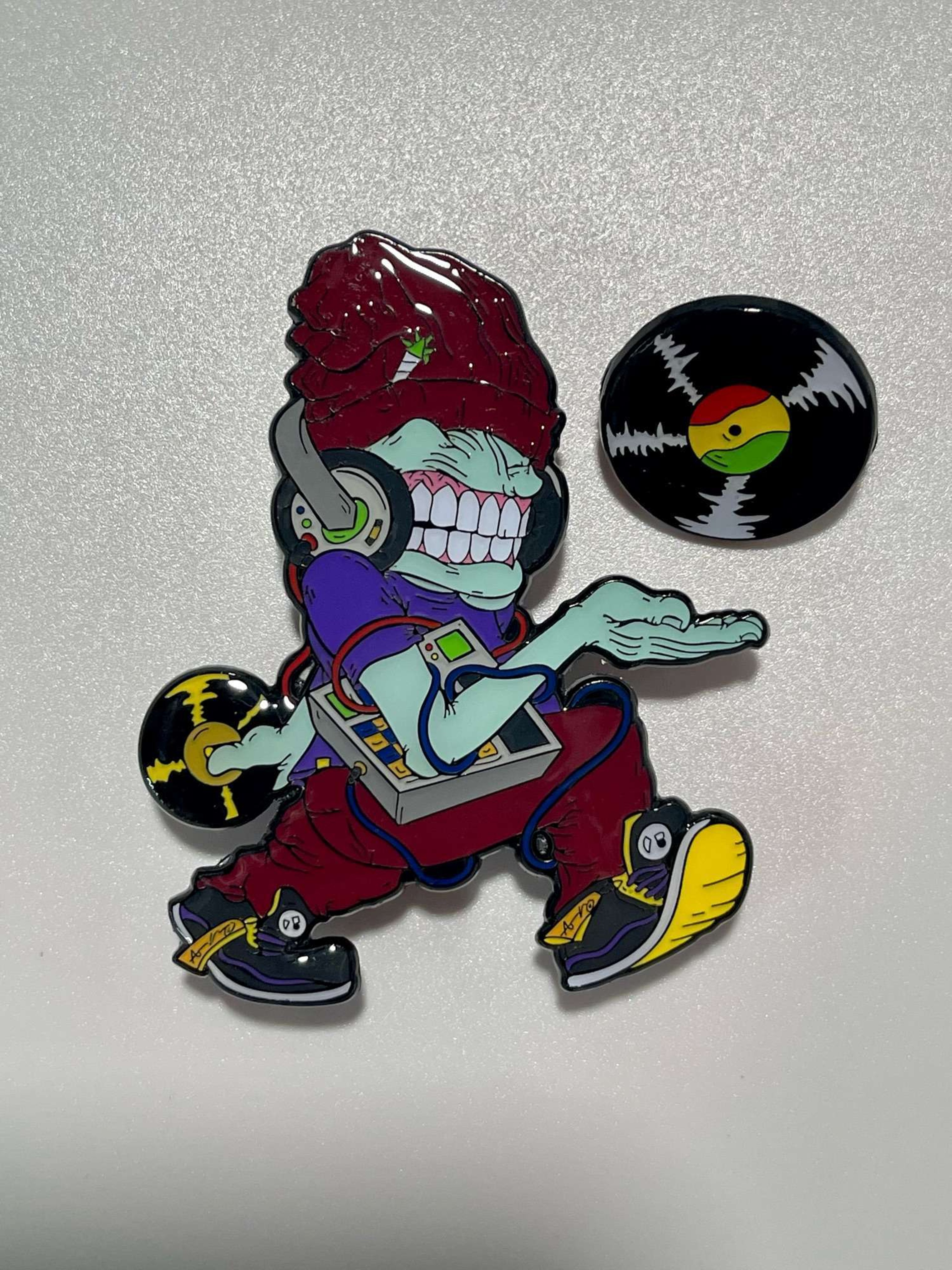 Preview pic of Aaron Brooks “Be The Beat” UV reactive limited edition Sold Out pin