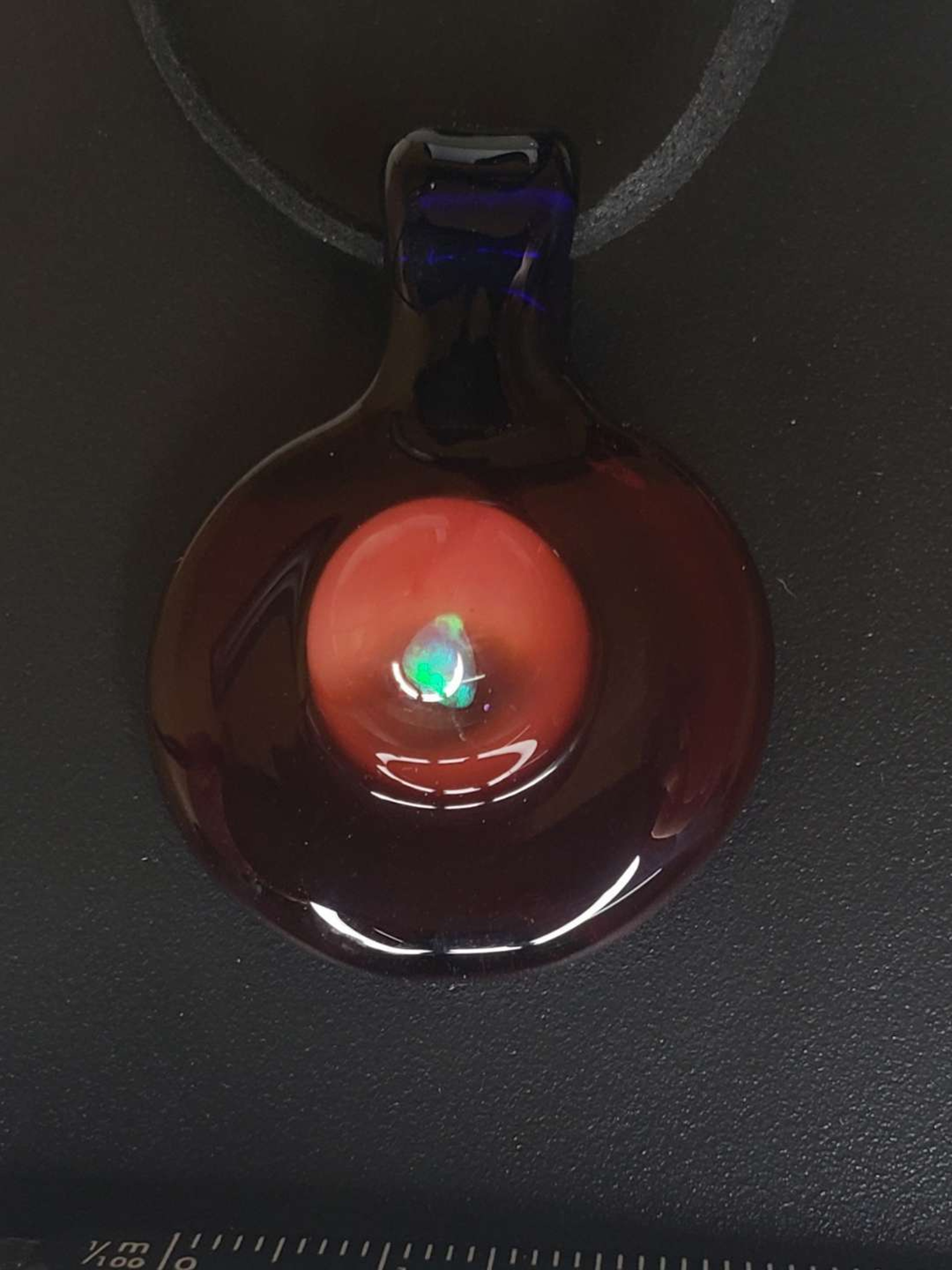 Preview pic of Red Elvis with blue cobalt pendant with an opal accent 