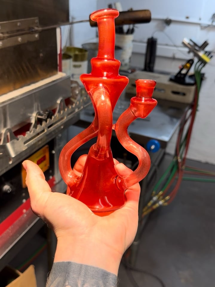 Floating Recycler in Moist Raspberry Over Icy White Satin Image