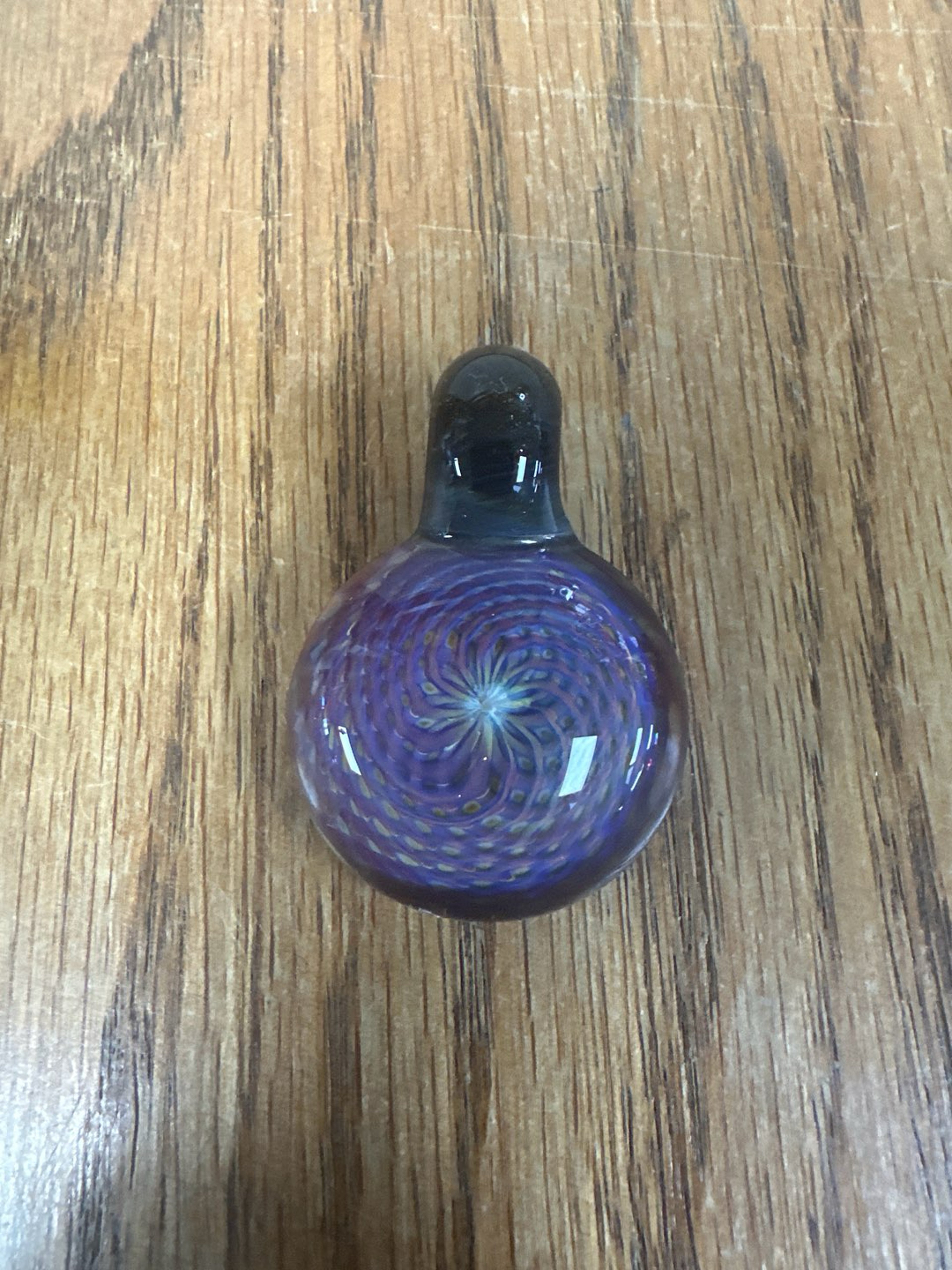 Preview pic of Reticello pendant in amber purple with green stardust fumed bail