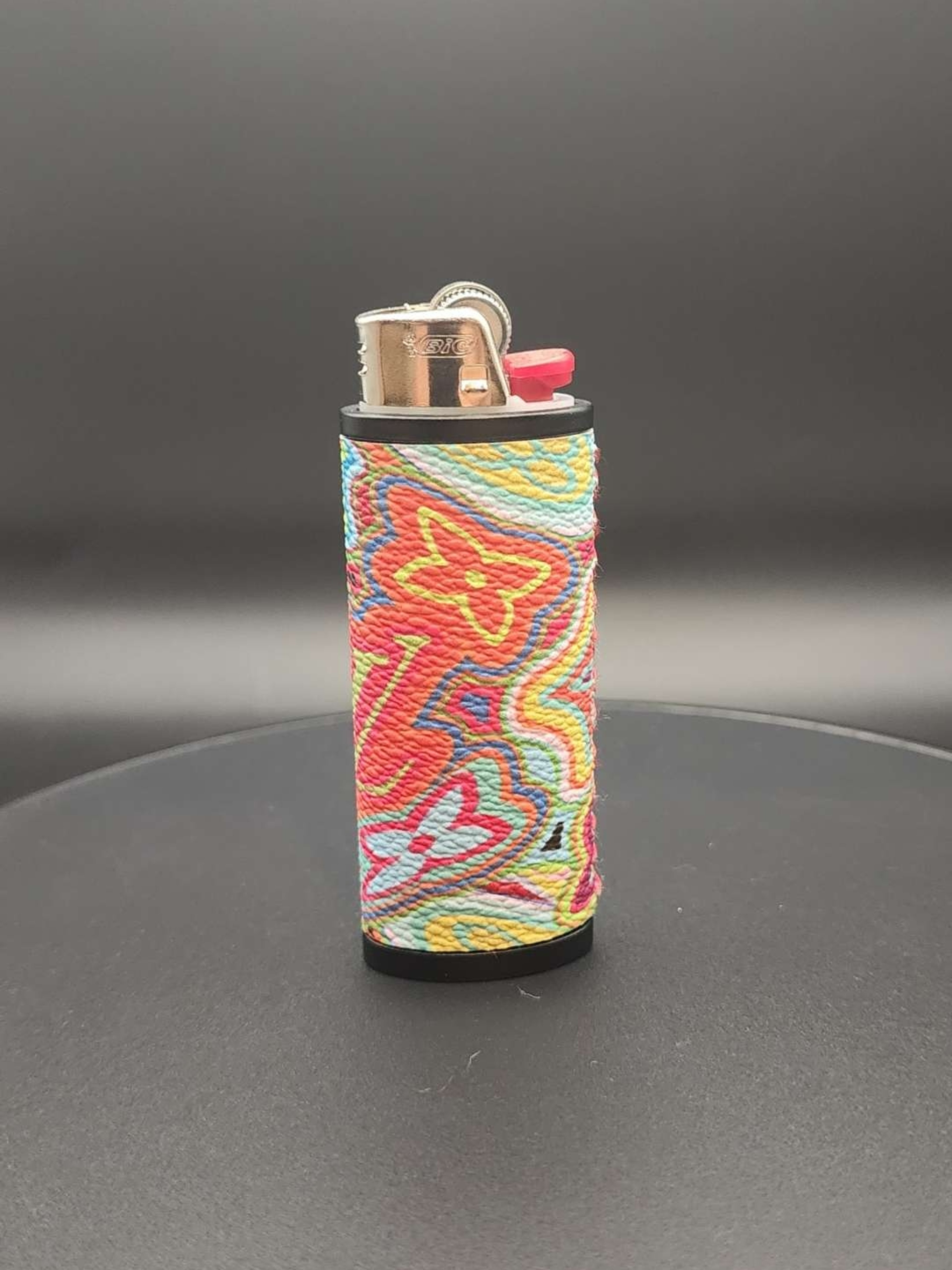 Preview pic of Adabadoo Tools Handstiched Bic Lighter Sleeve with Trippy LV Design