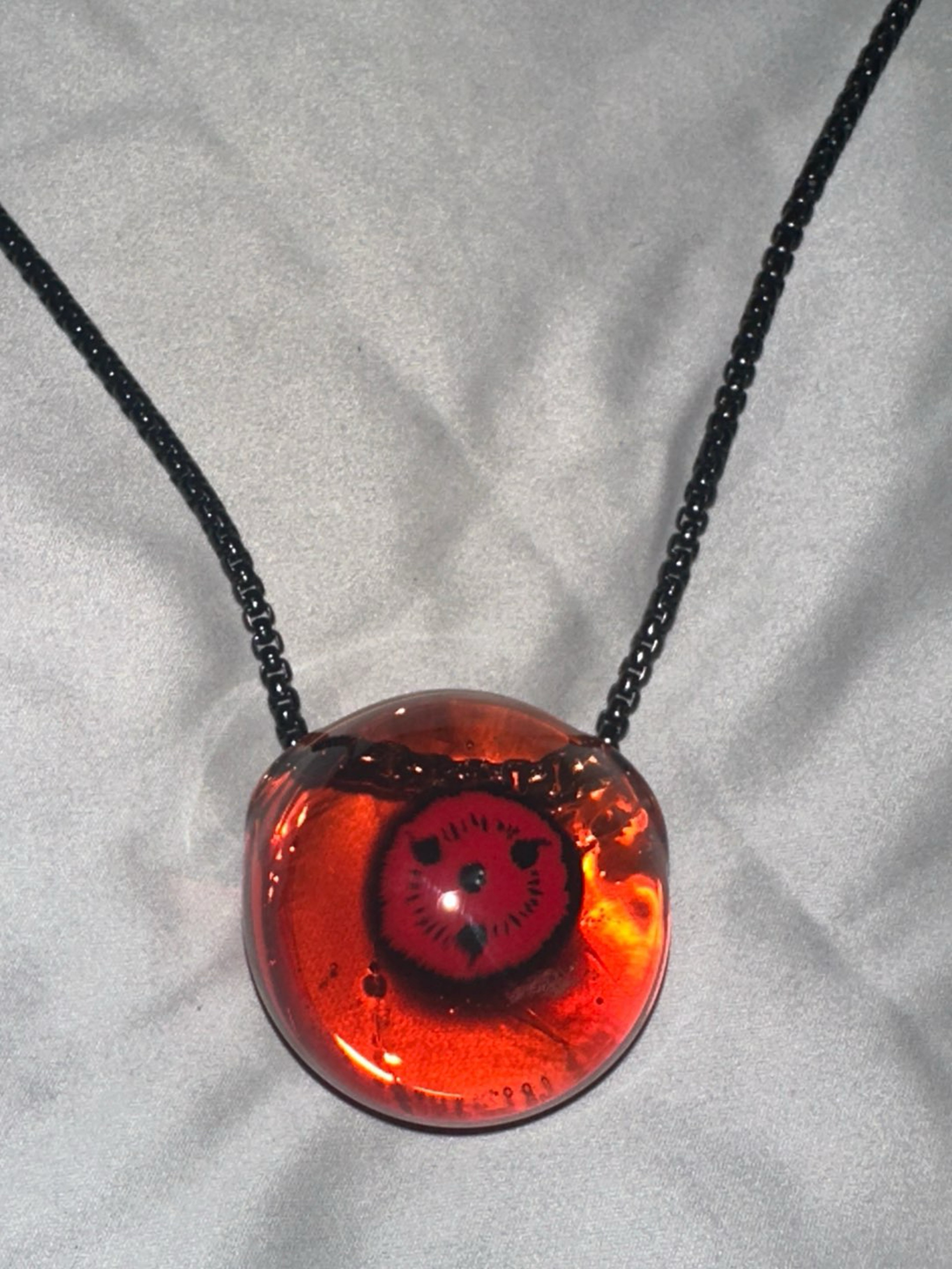 Preview pic of Sunstone Sharingan milli pendant
