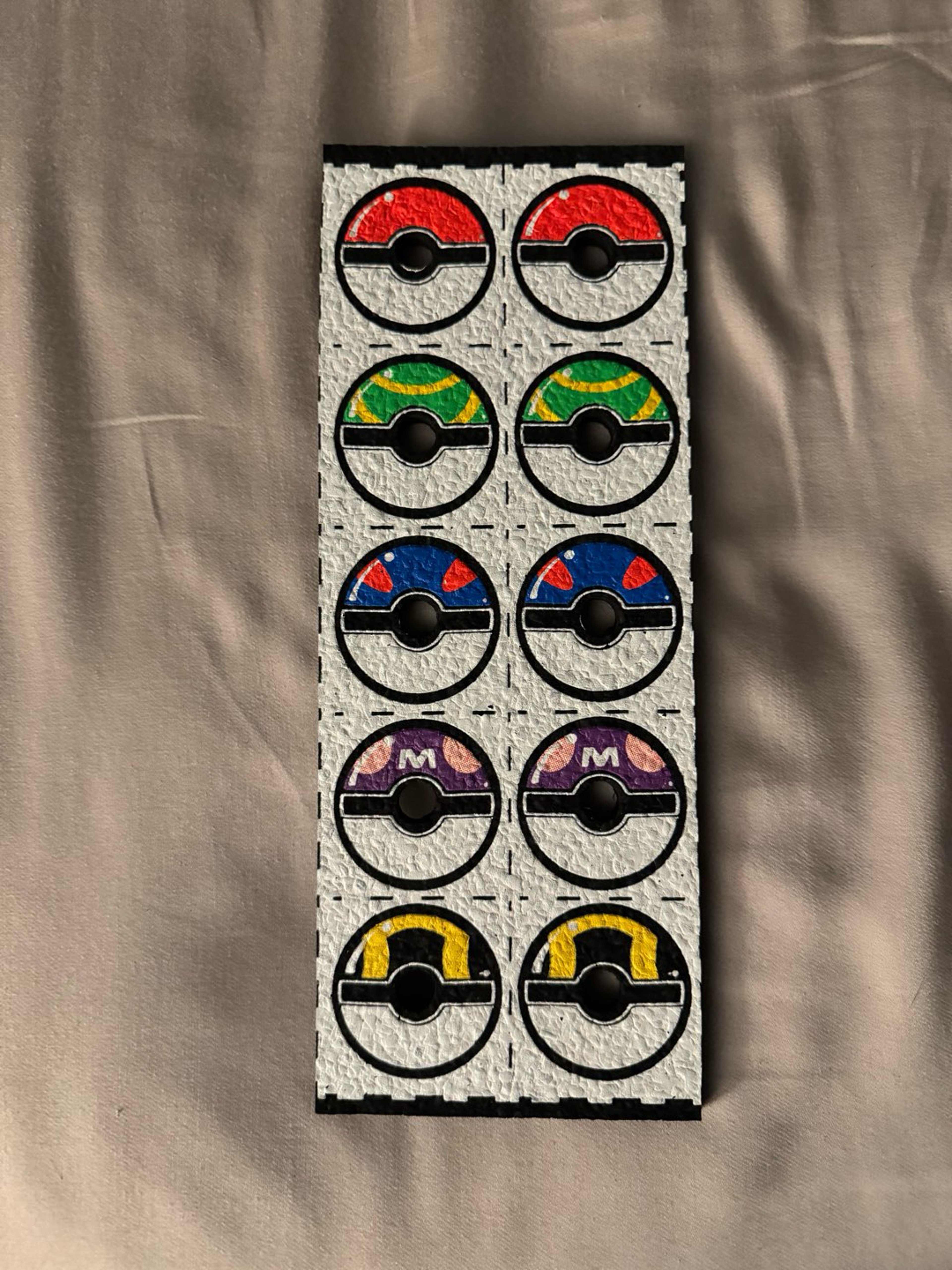 Preview pic of Pokeball strip by Dark mountain cult! Marble/cap holder for table or display