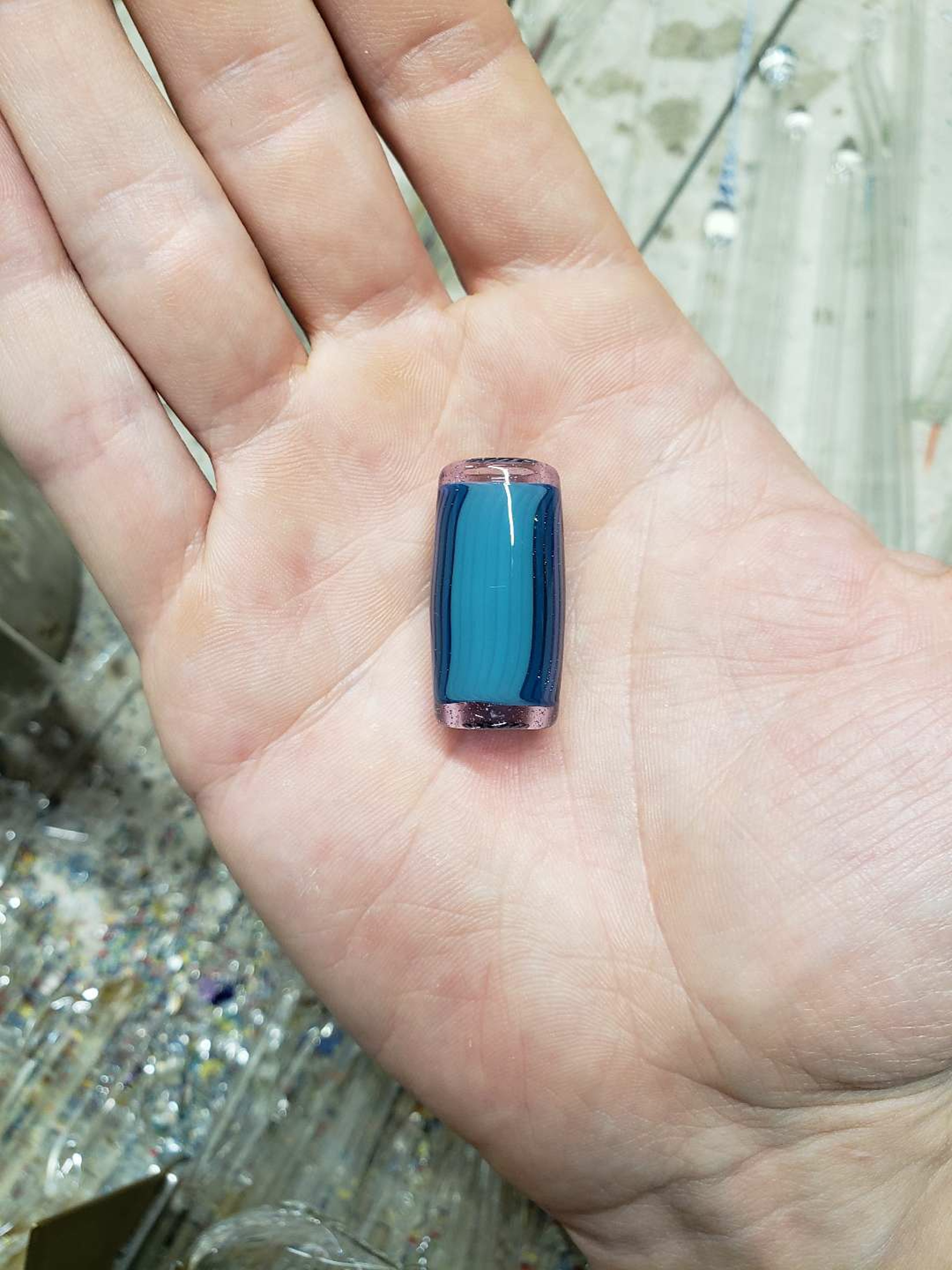 Preview pic of Small half blue and half black/ white glass bead w/ purple lip wraps