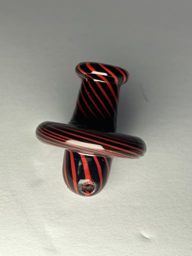 Preview pic of black and red swirl carb cap