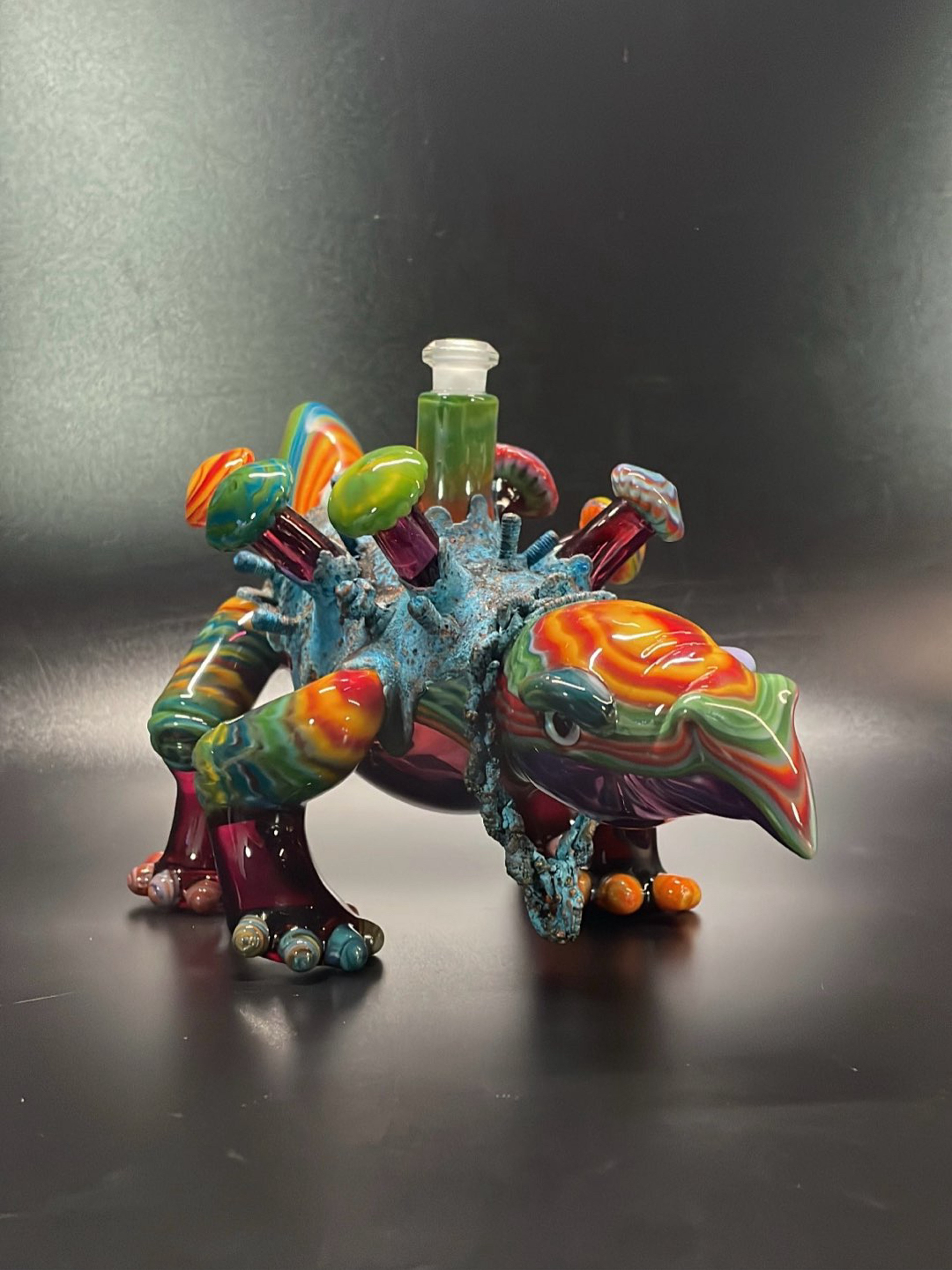 Preview pic of Amorphous Symphony X Mak Glass Fordite and Electroplating Stegosaurus