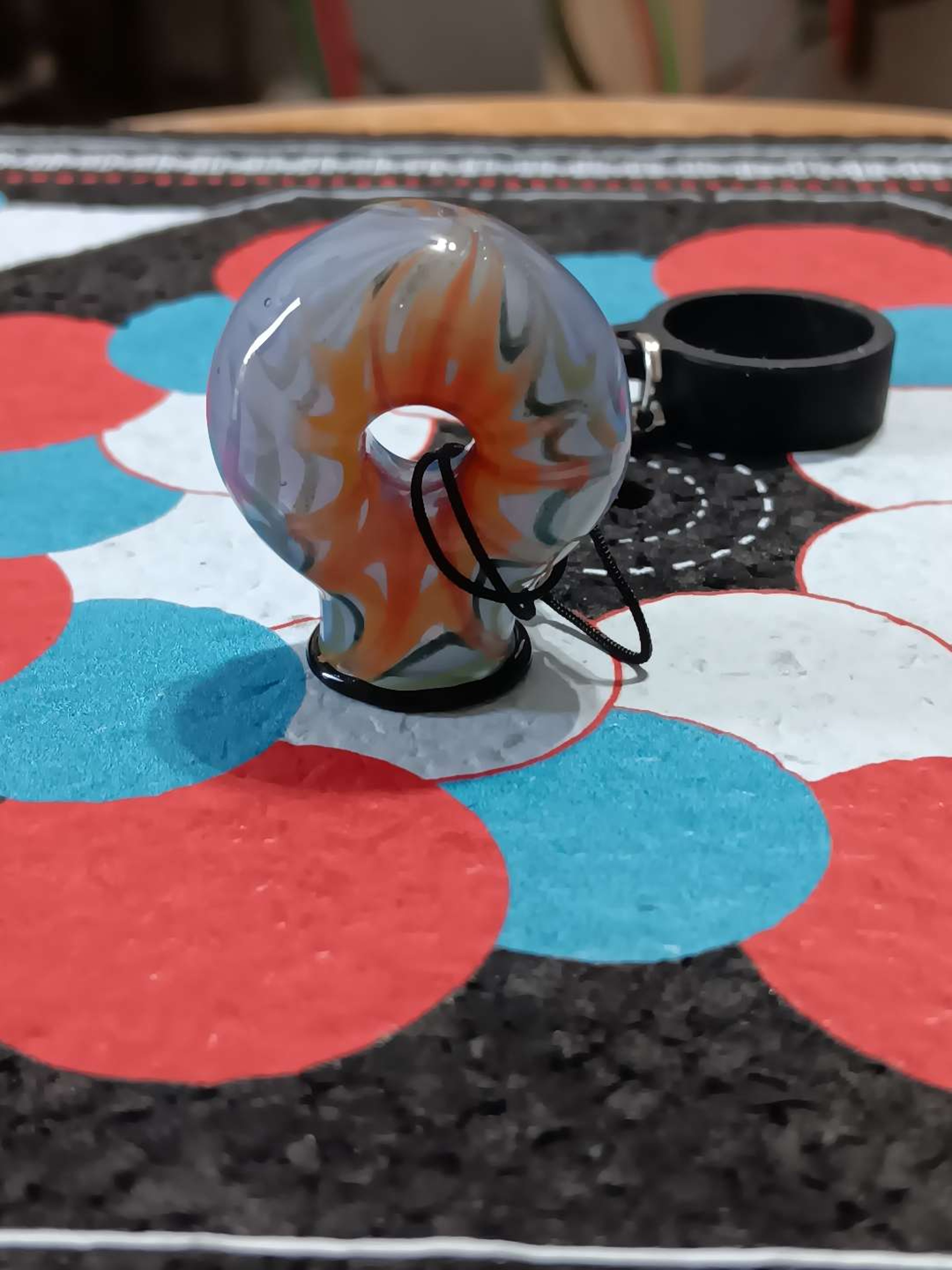 Preview pic of Tye dye donut hole puffco pivot top and teather