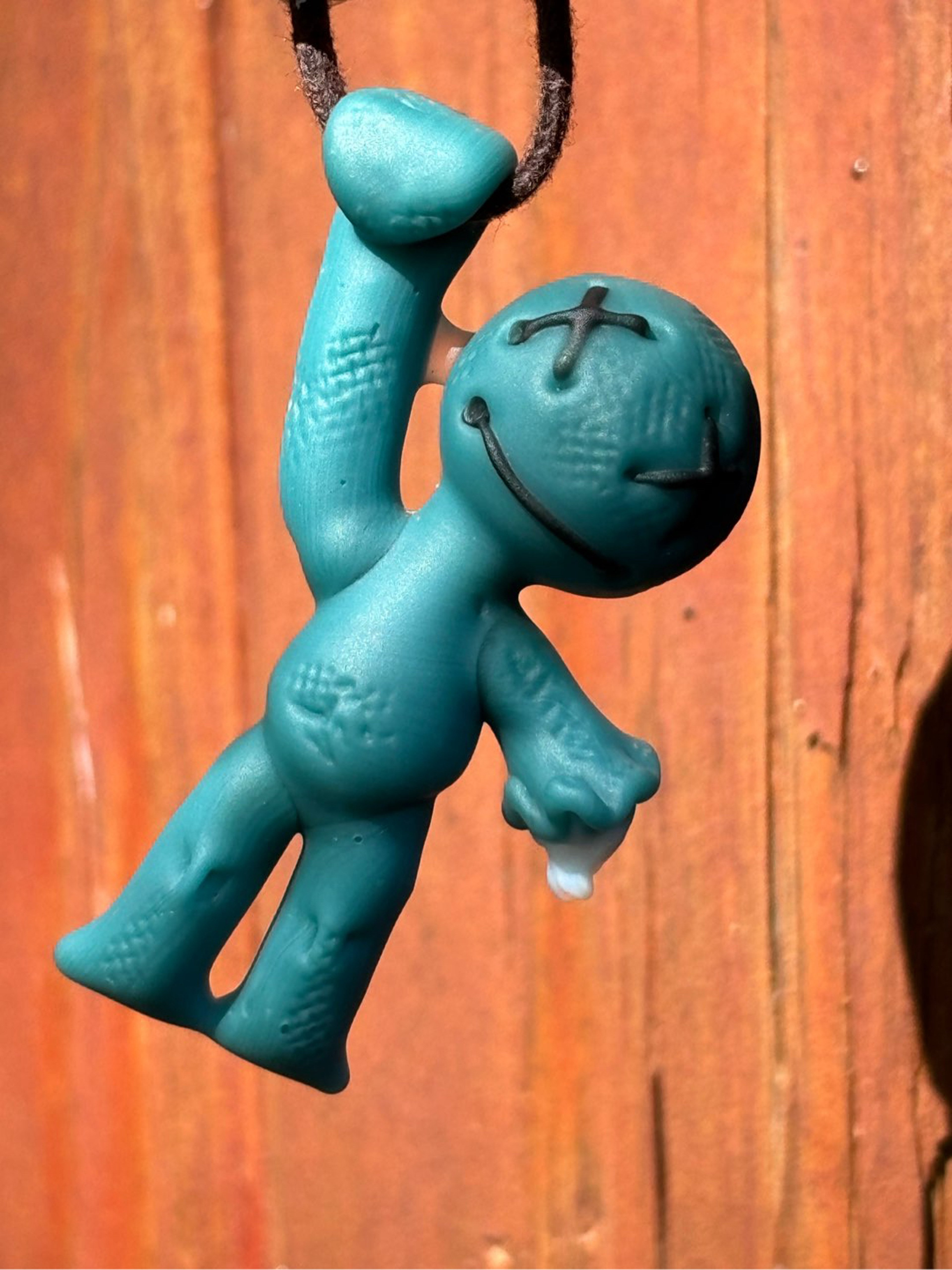 Preview pic of Muller hanging man voodoo doll pendant teal