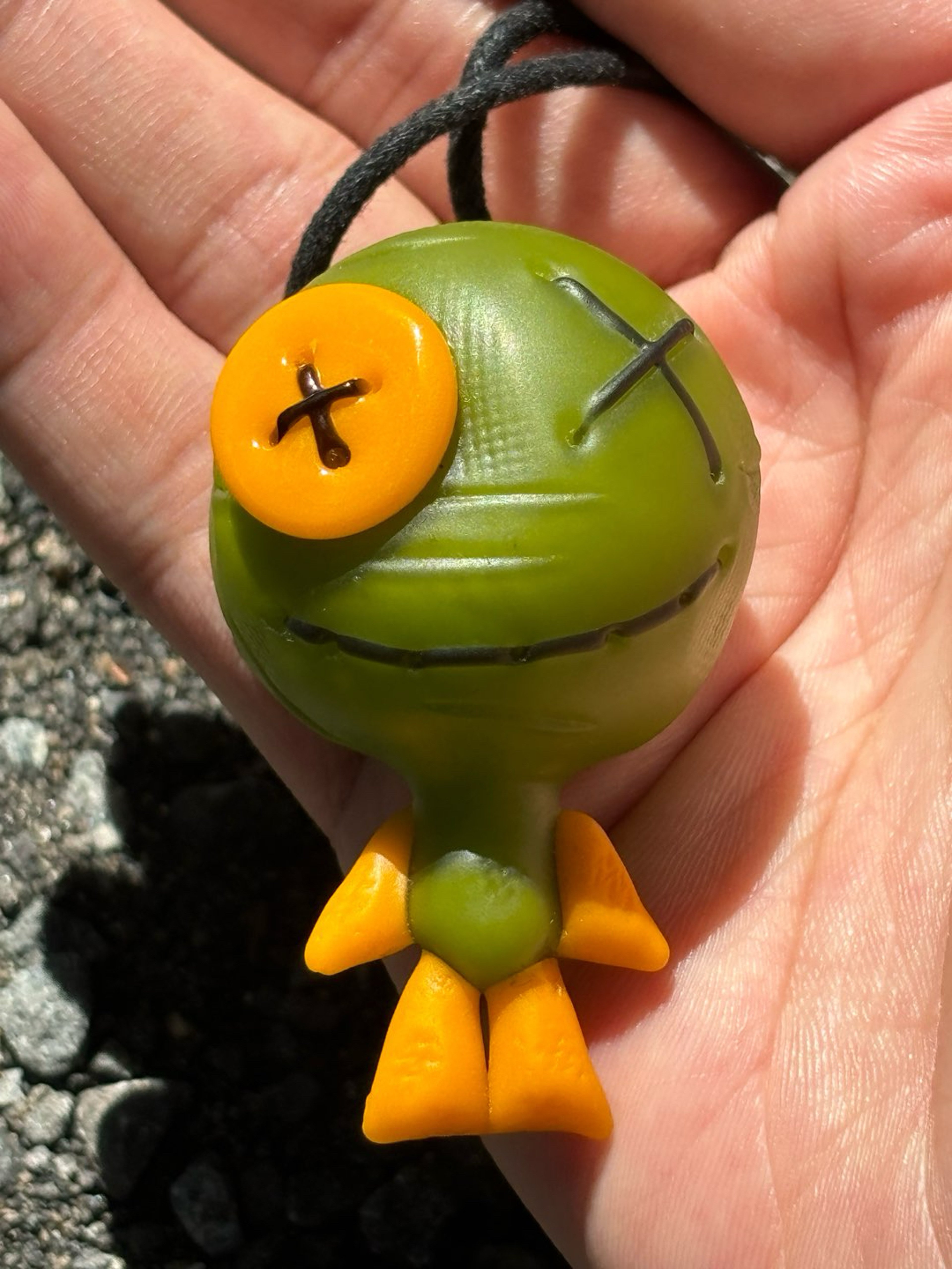 Preview pic of Muller voodoo doll hanging man pendant green yellow