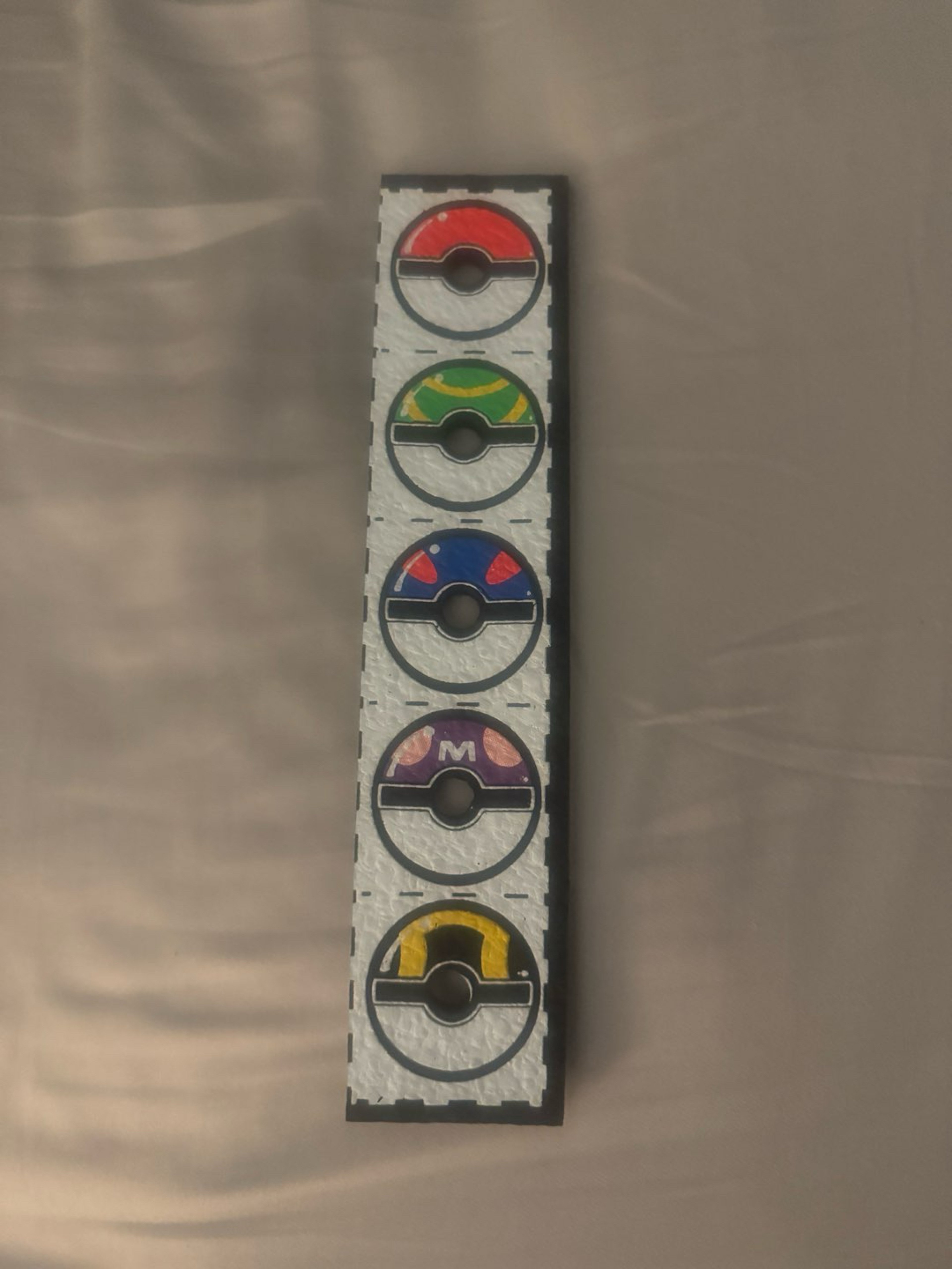 Preview pic of Single Pokeball strip by Dark mountain cult! Marble/cap holder for table or display