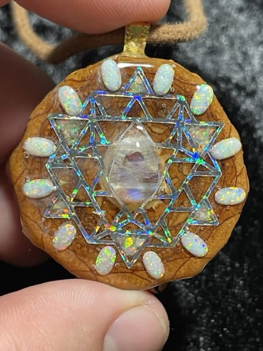 Preview pic of Beautiful AuraPincones Opal Moonstone 64 Star Tetrahedron Geometry Pendant