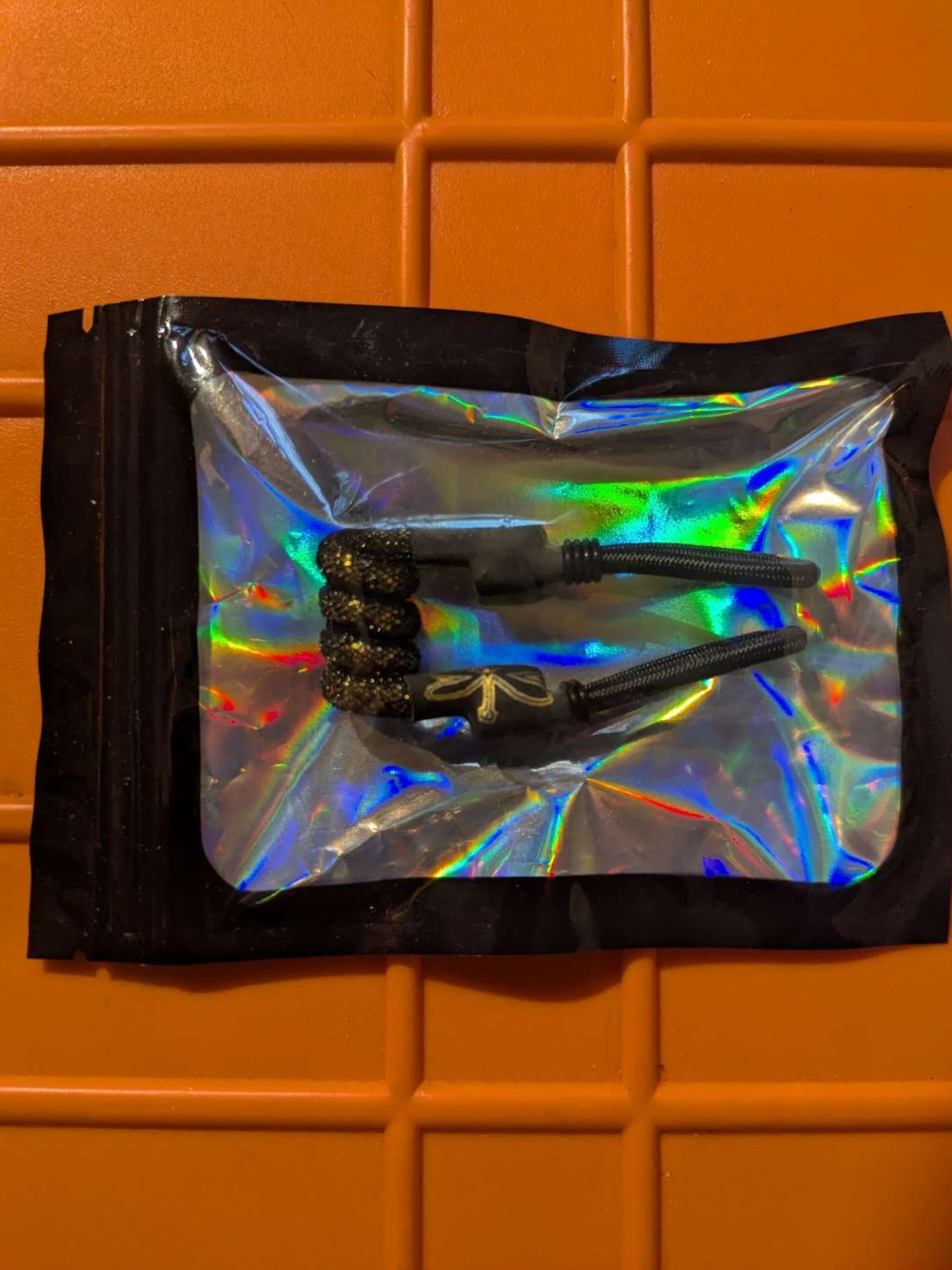Preview pic of Gold and Black Puffco Tuff Tether