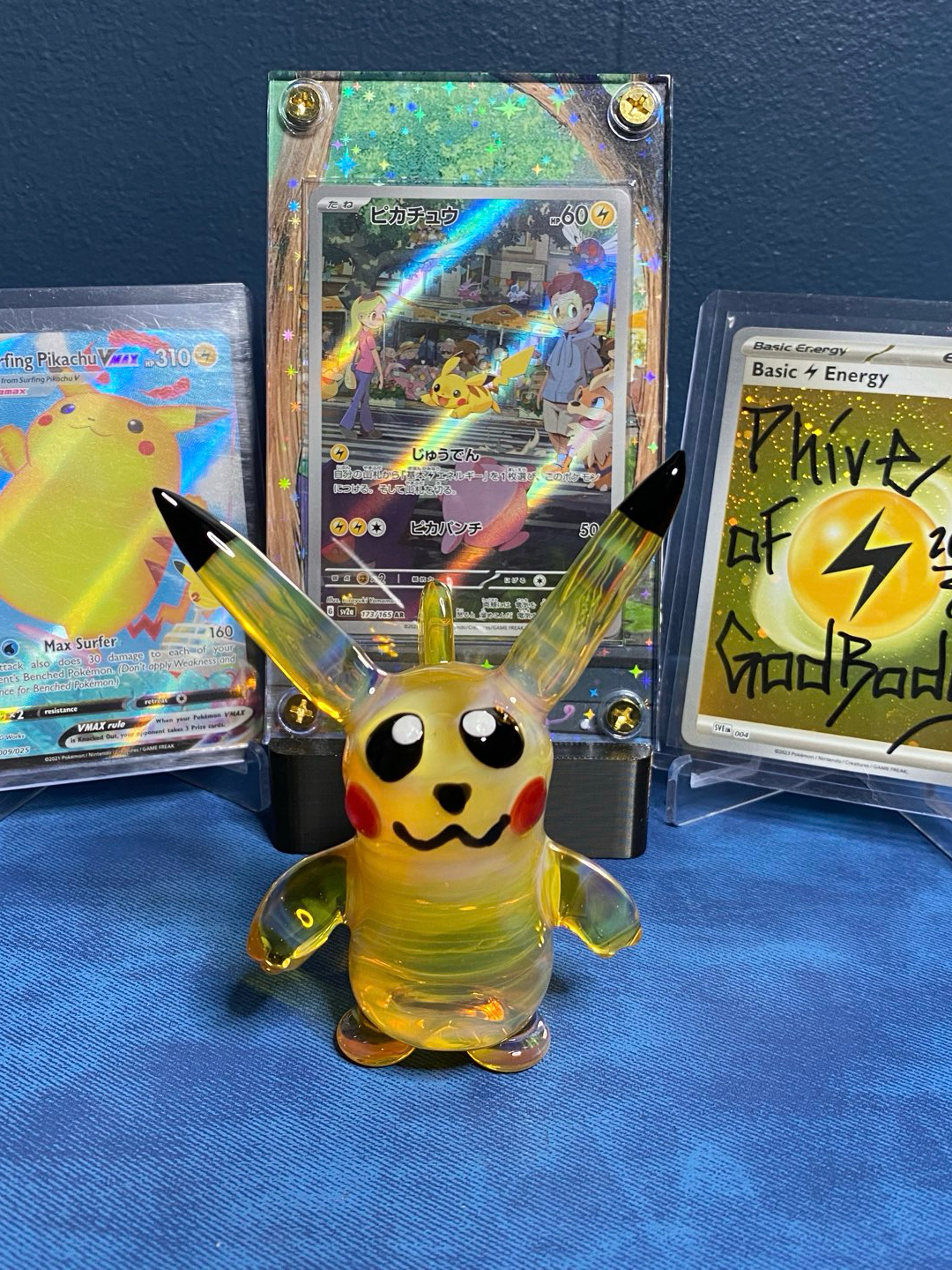 Preview pic of Pikachu Glass Desk Piece w/ JPN 151 Pikachu AR in Extended Art Case, Surfing Pikachu VMax & Energy!