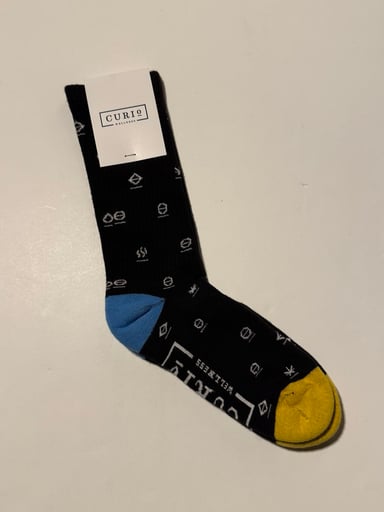 Preview pic of Curio Wellness Crew Socks & Sticker