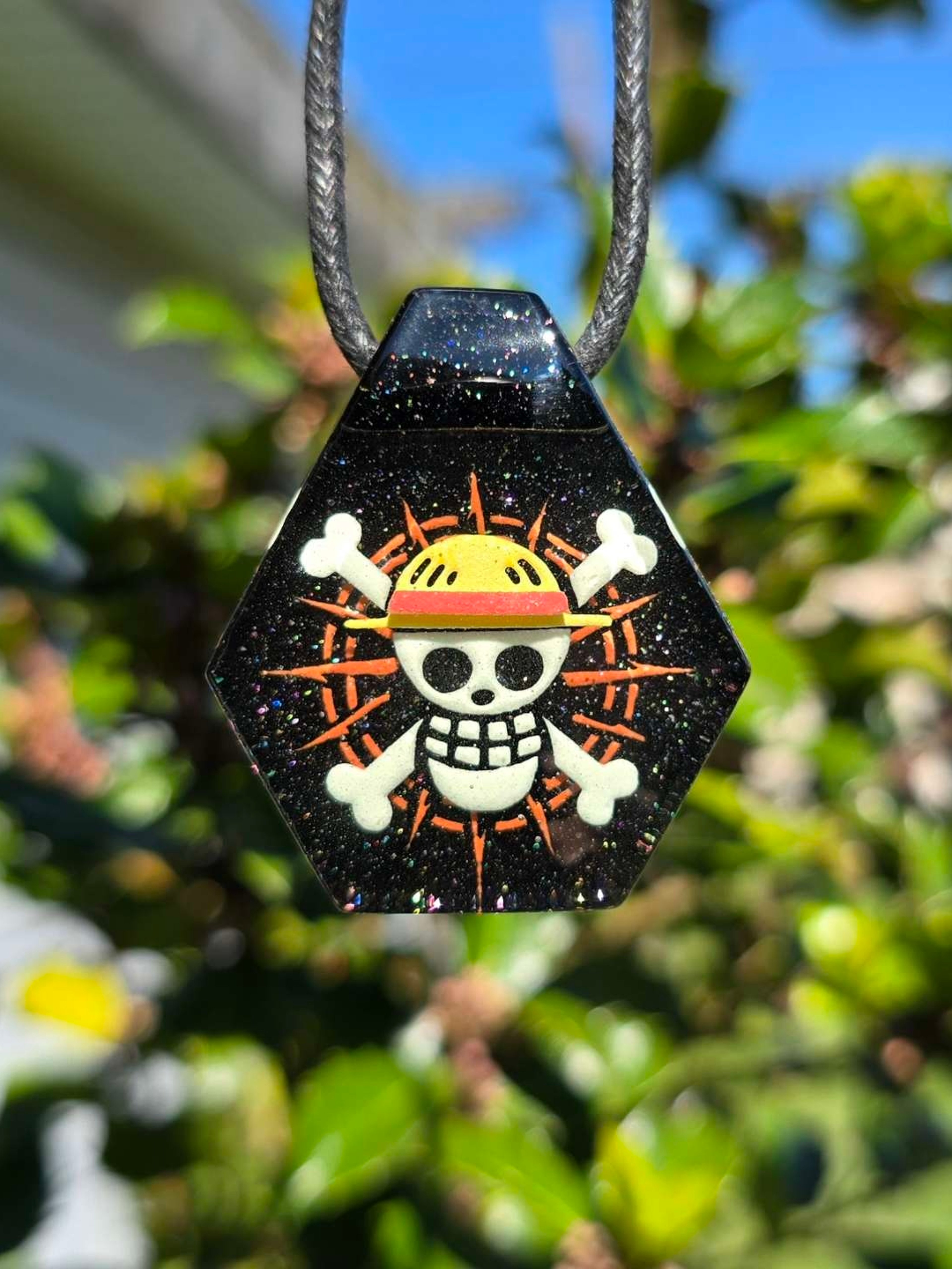 Preview pic of One Piece Jolly Roger Layered Glow UV Pendant