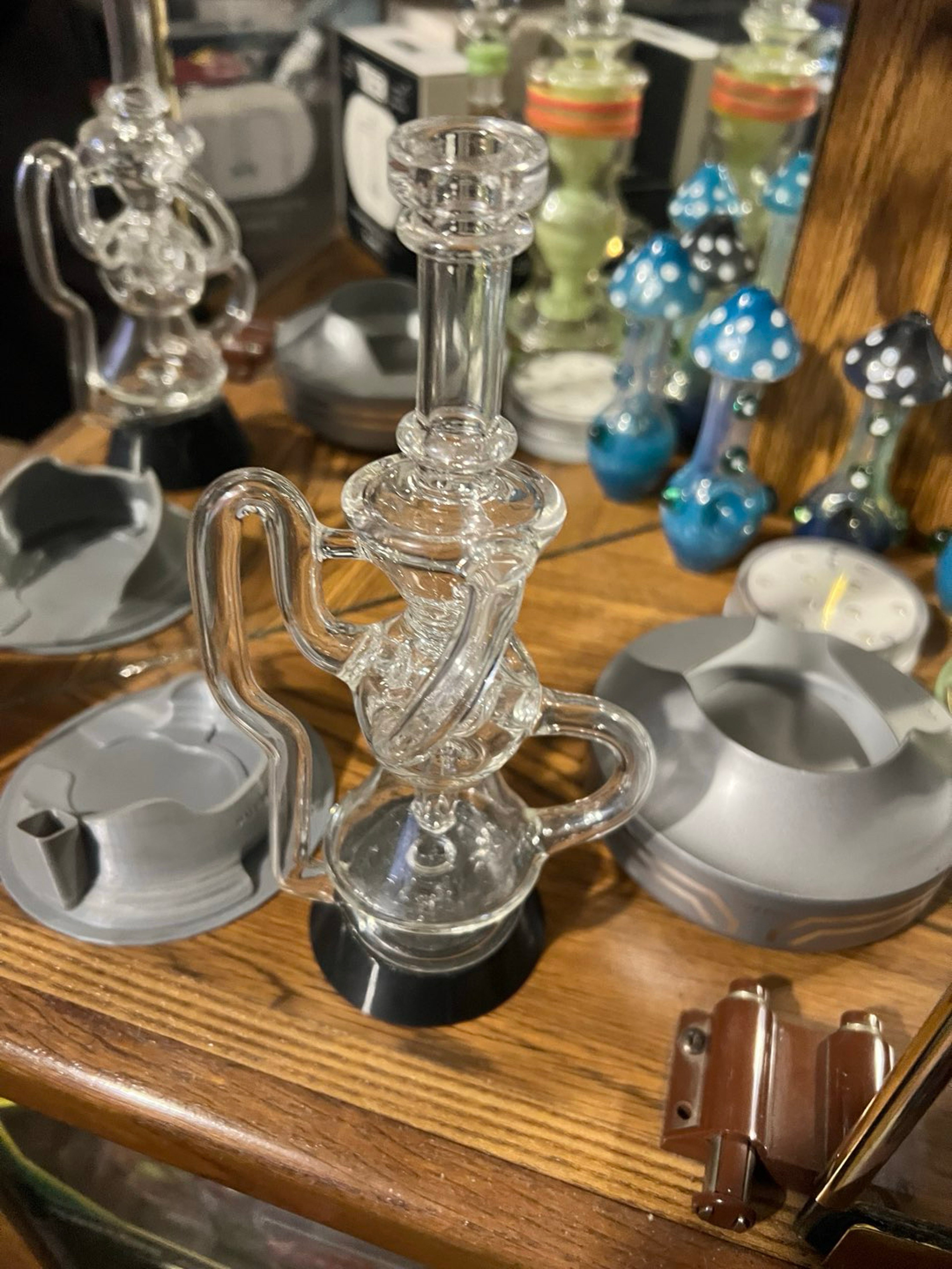Preview pic of Puffco top iridescent glass company “worm hole recycler”
