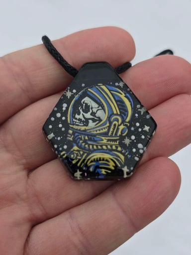 Preview pic of Astronaut Skull Layered Glow Pendant