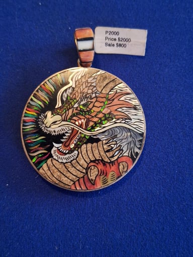 Preview pic of David freeland dragon pendant handmade with gems carved n placed into sterling silver