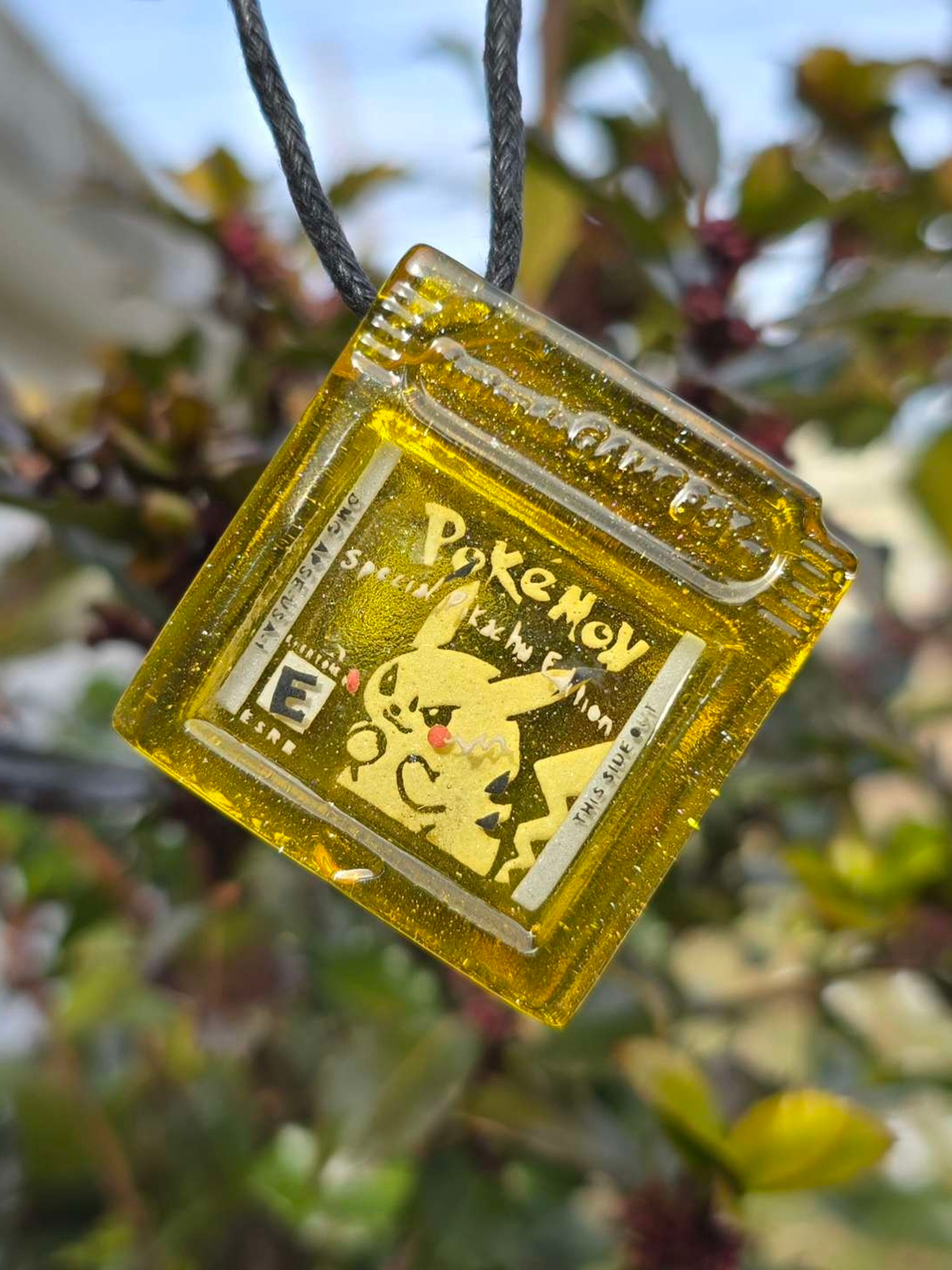 Preview pic of Seconds Pokemon Yellow Glow UV Pendant