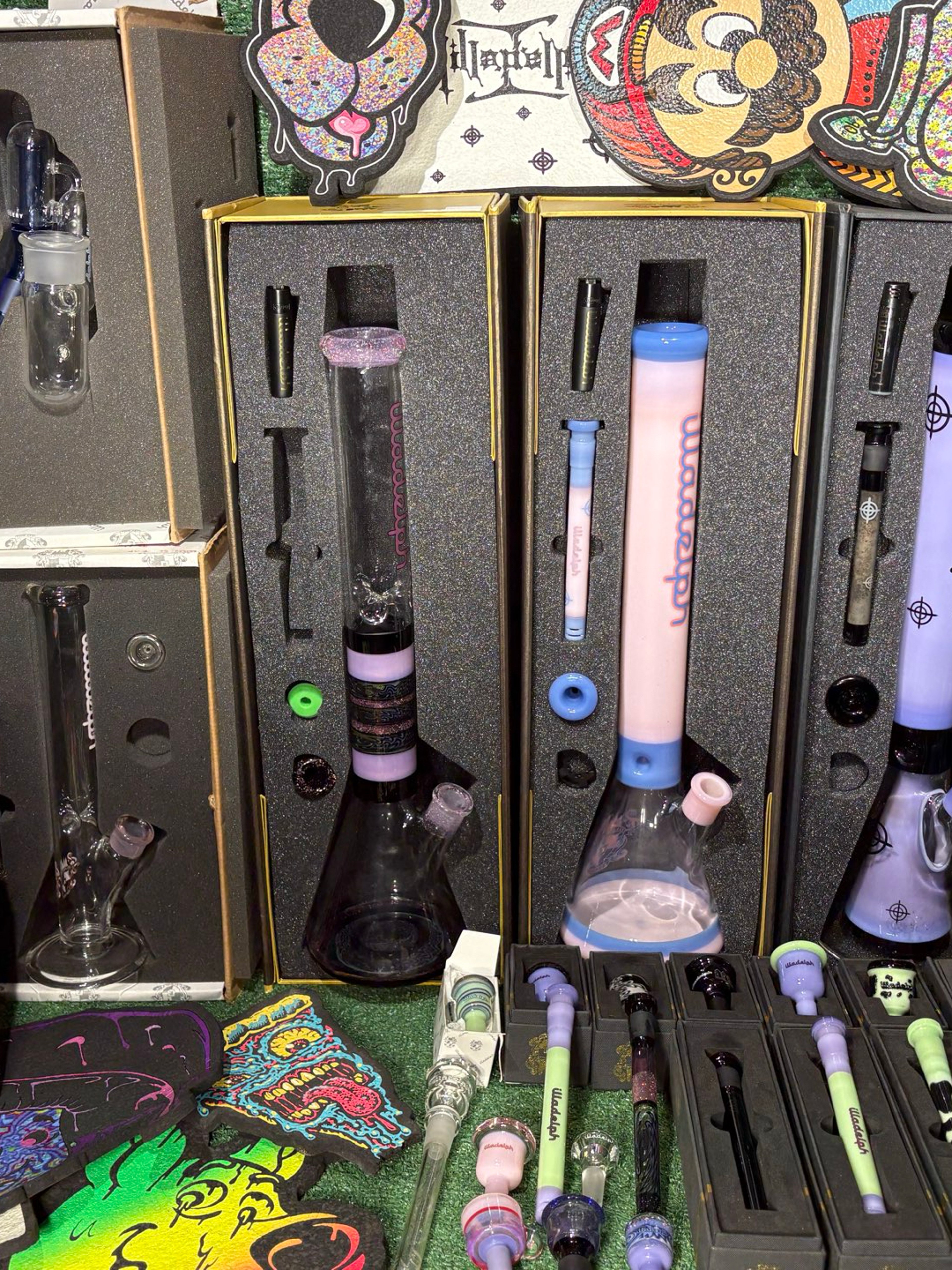 Preview pic of Complete illadelph collection! 3 beakers and fell sets, 13 slides, 8 downstems, 10 mood mats, new encalmo disc ash catcher, 1 brand new straight illadelph bong!