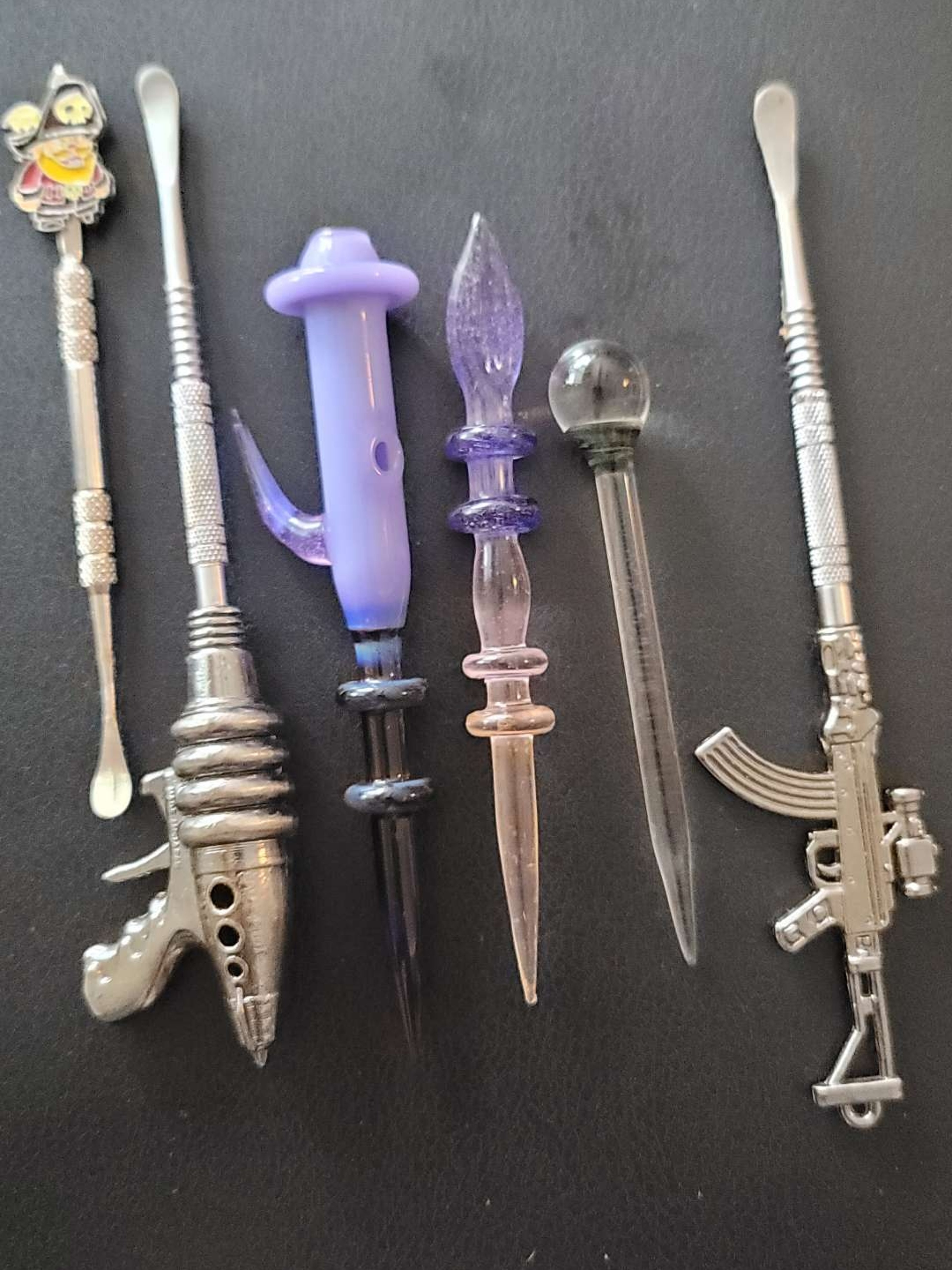 Preview pic of Dabbers of all kinds. Bundle deal or Individual available as well.  Glass, steel, cartoon and 2 in 1 carb cap dabber.