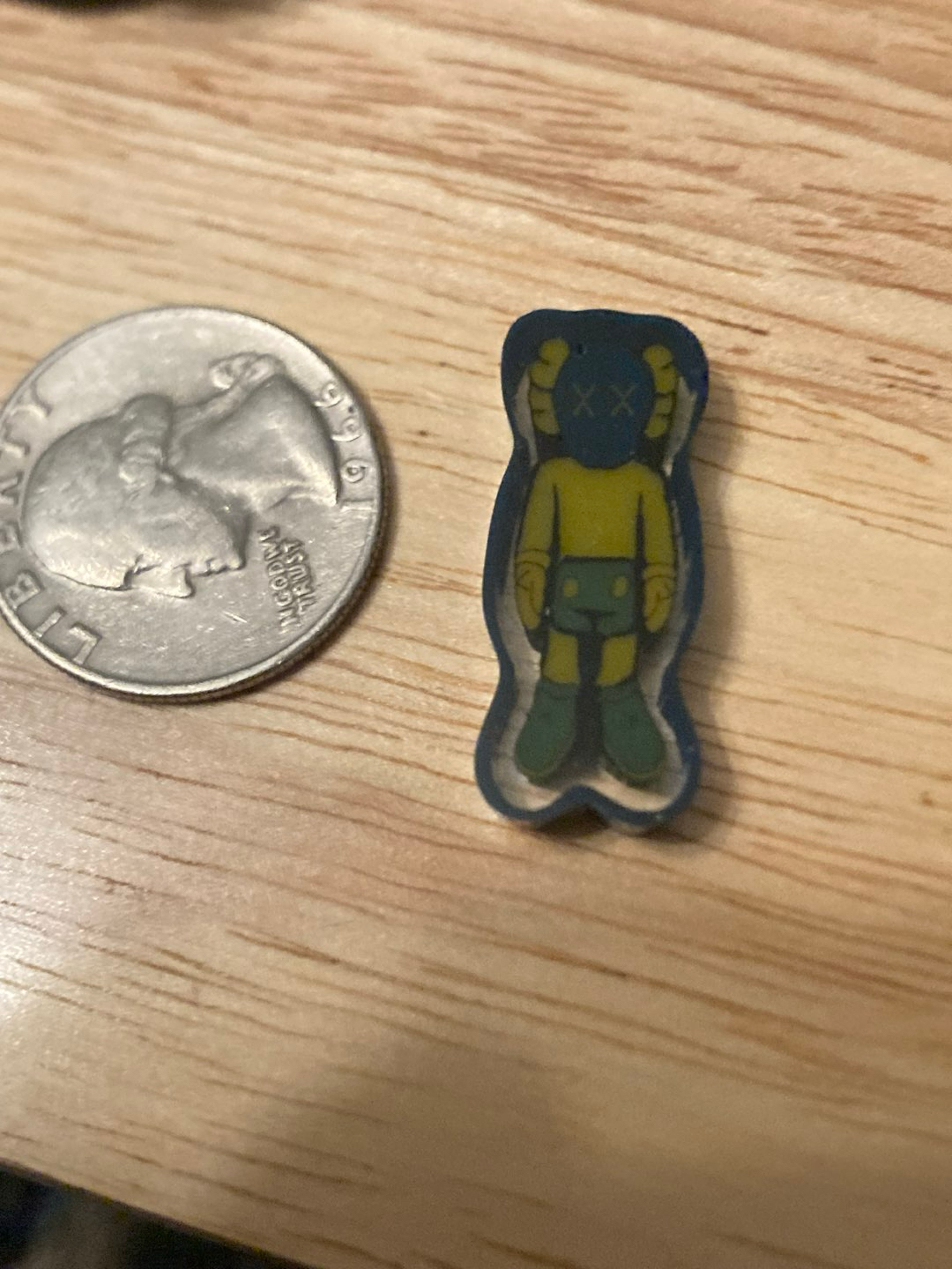 Preview pic of Kawsxmcmilleman blue uv coin