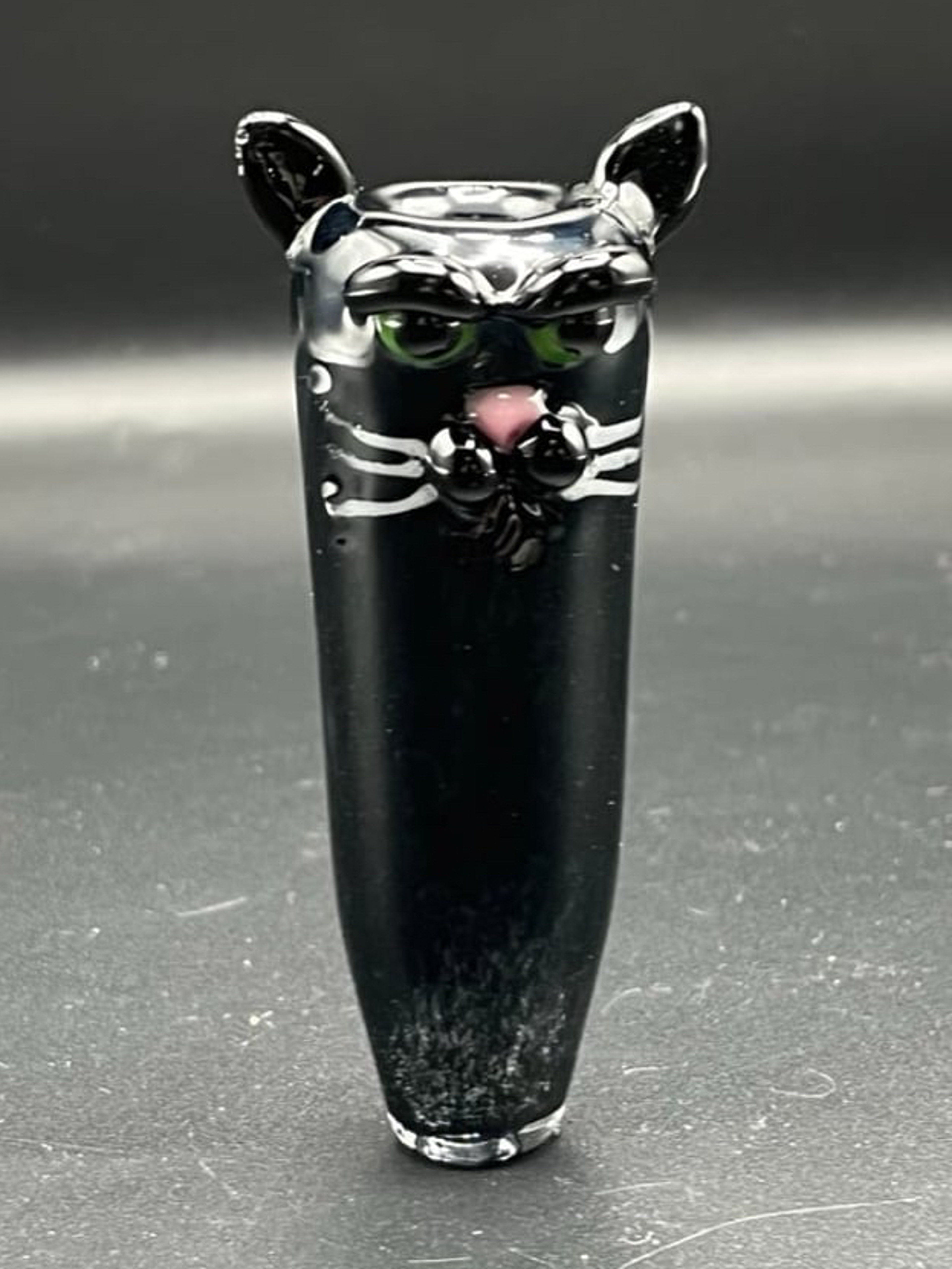 Black glass cat with green eyes push boel chillum. image 0