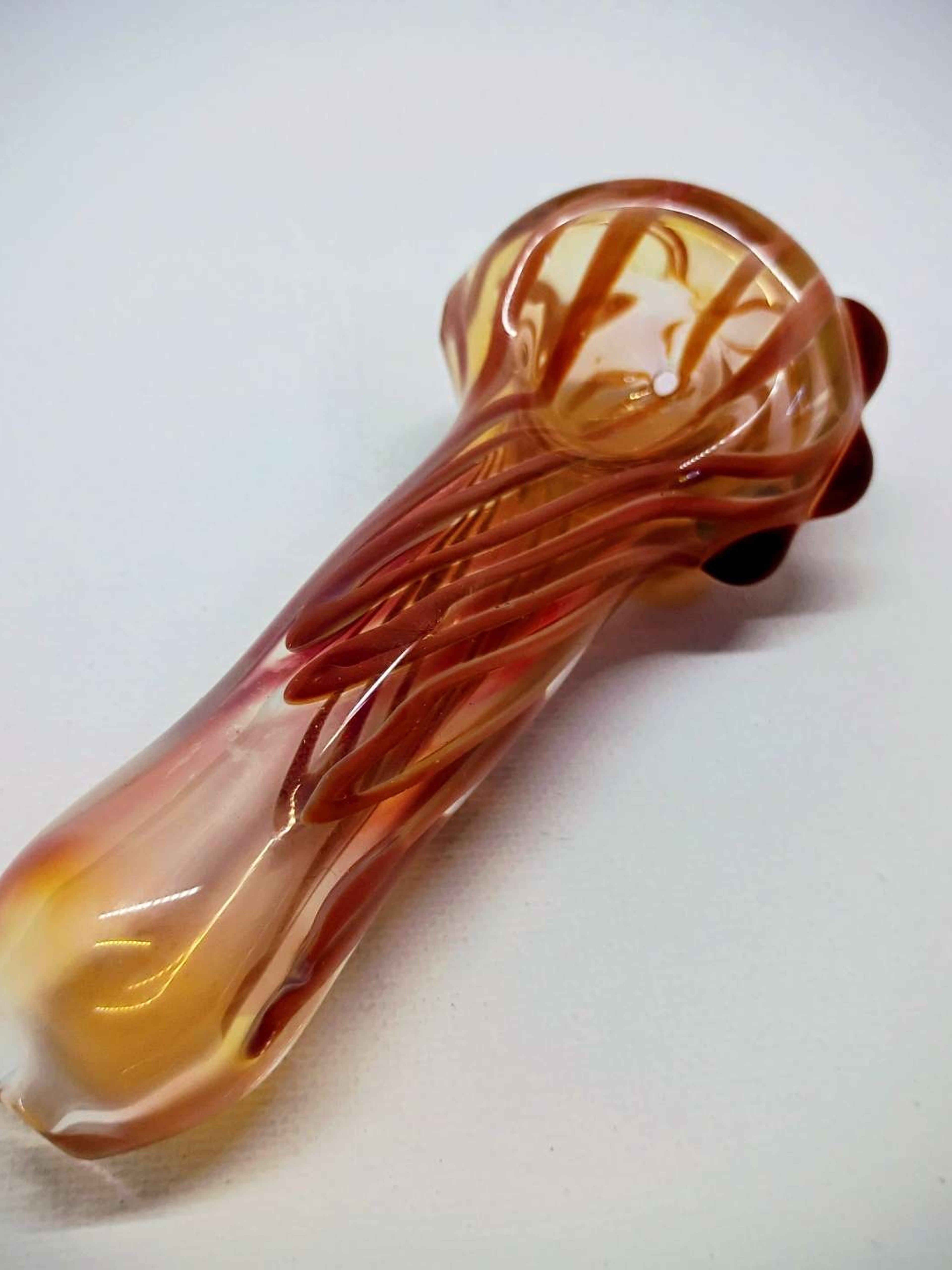Preview pic of Citrus Salutation. Hand blown color changing 24k gold and Sterling silver fumed iridescent glass pipe.