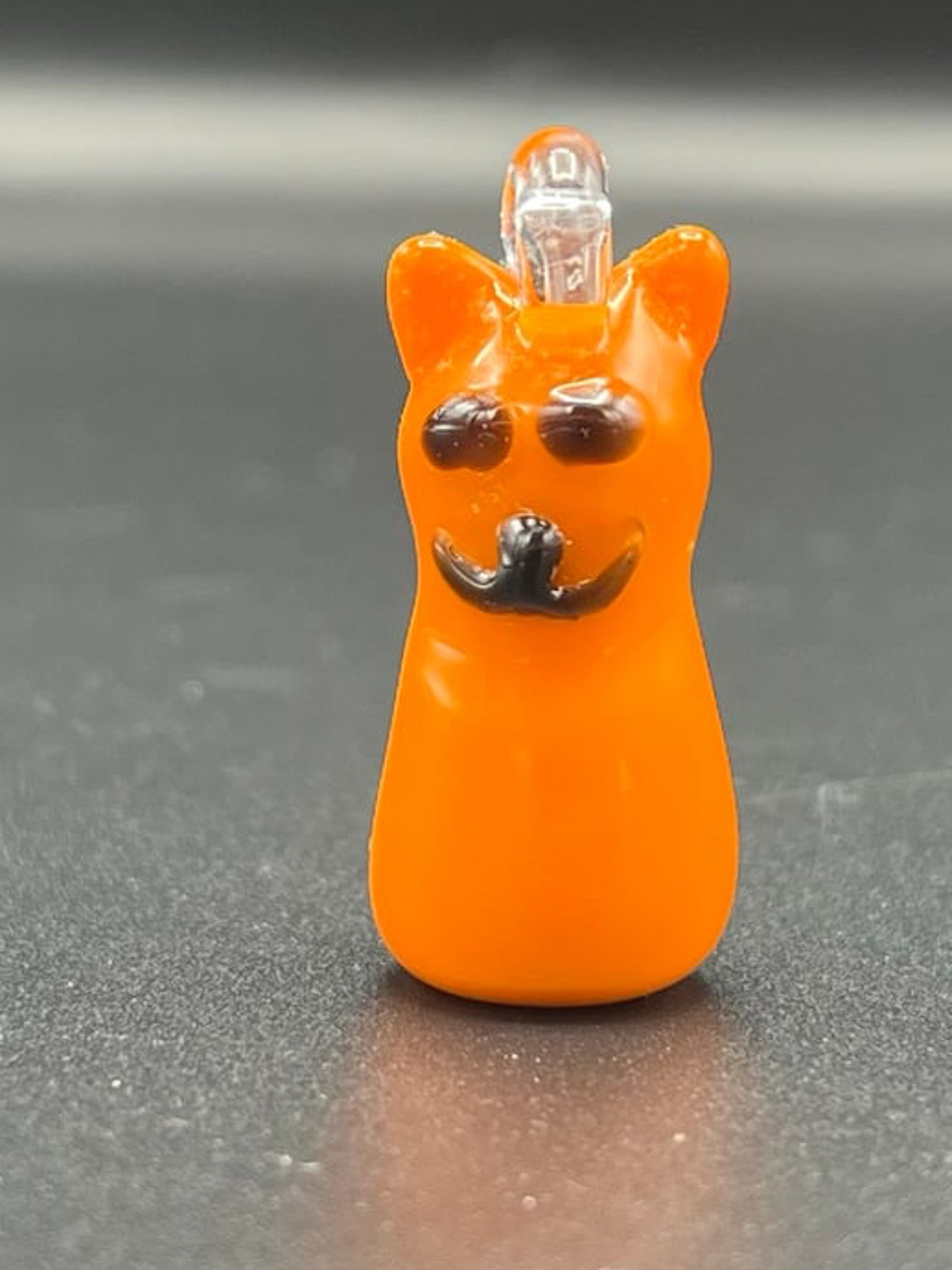 Preview pic of Lava orange smiley face cat pendant.