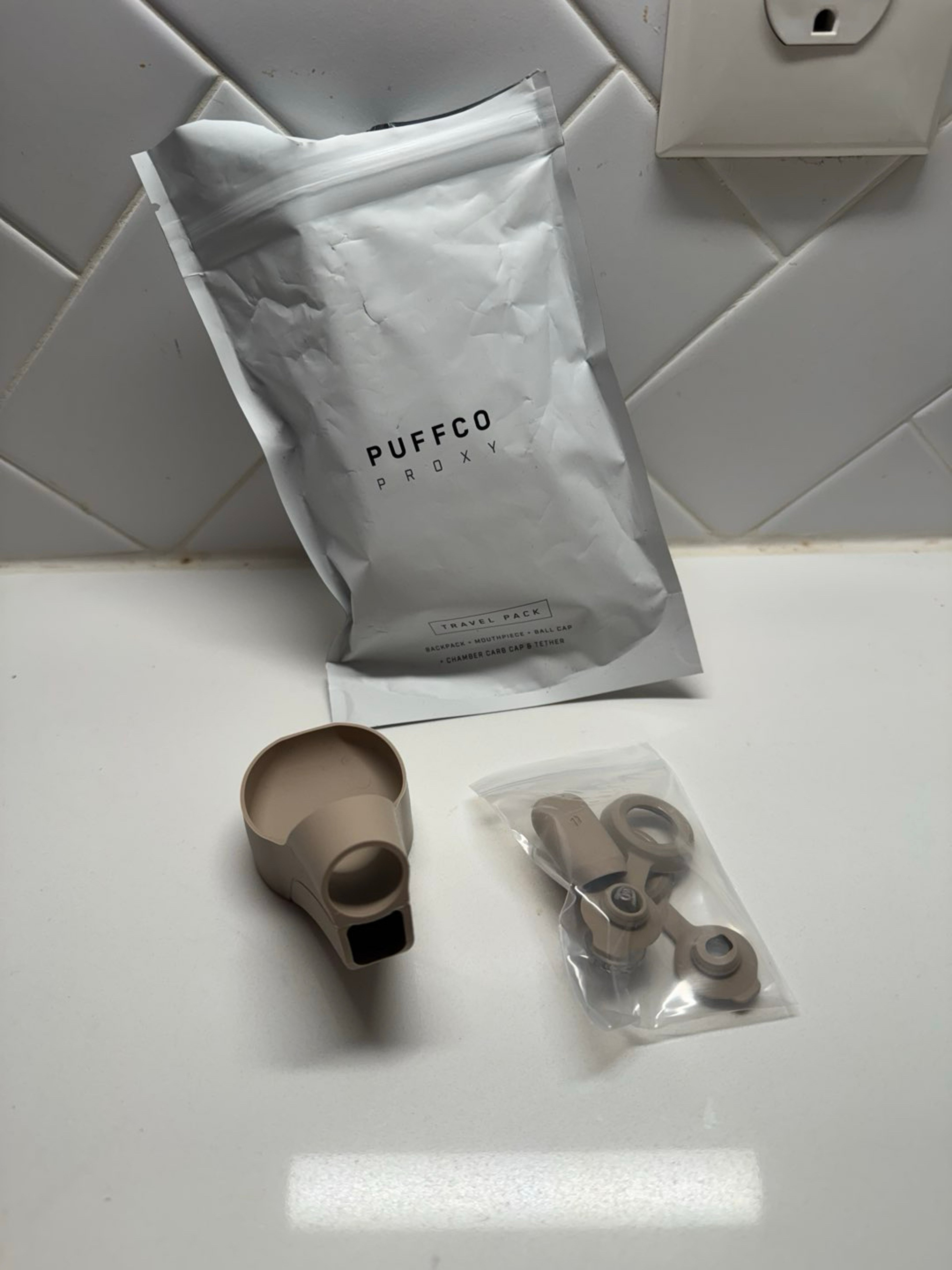 Preview pic of Puff Co. Proxy travel pack, mouthpiece ball cap chamber cap