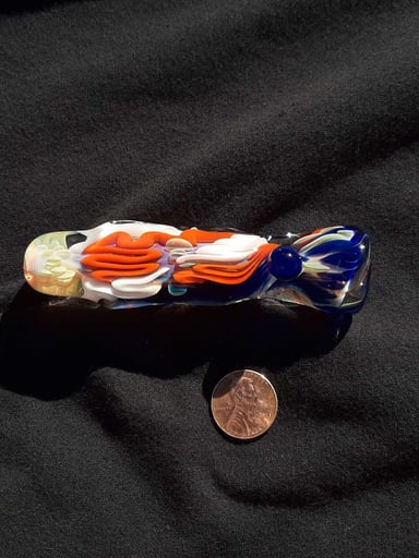 Preview pic of Inside out, color changing, borosilicate glass chillum with a flattened mouth