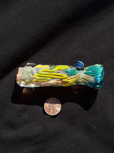 Preview pic of Inside out, color changing, borosilicate glass chillum with a flattened mouth