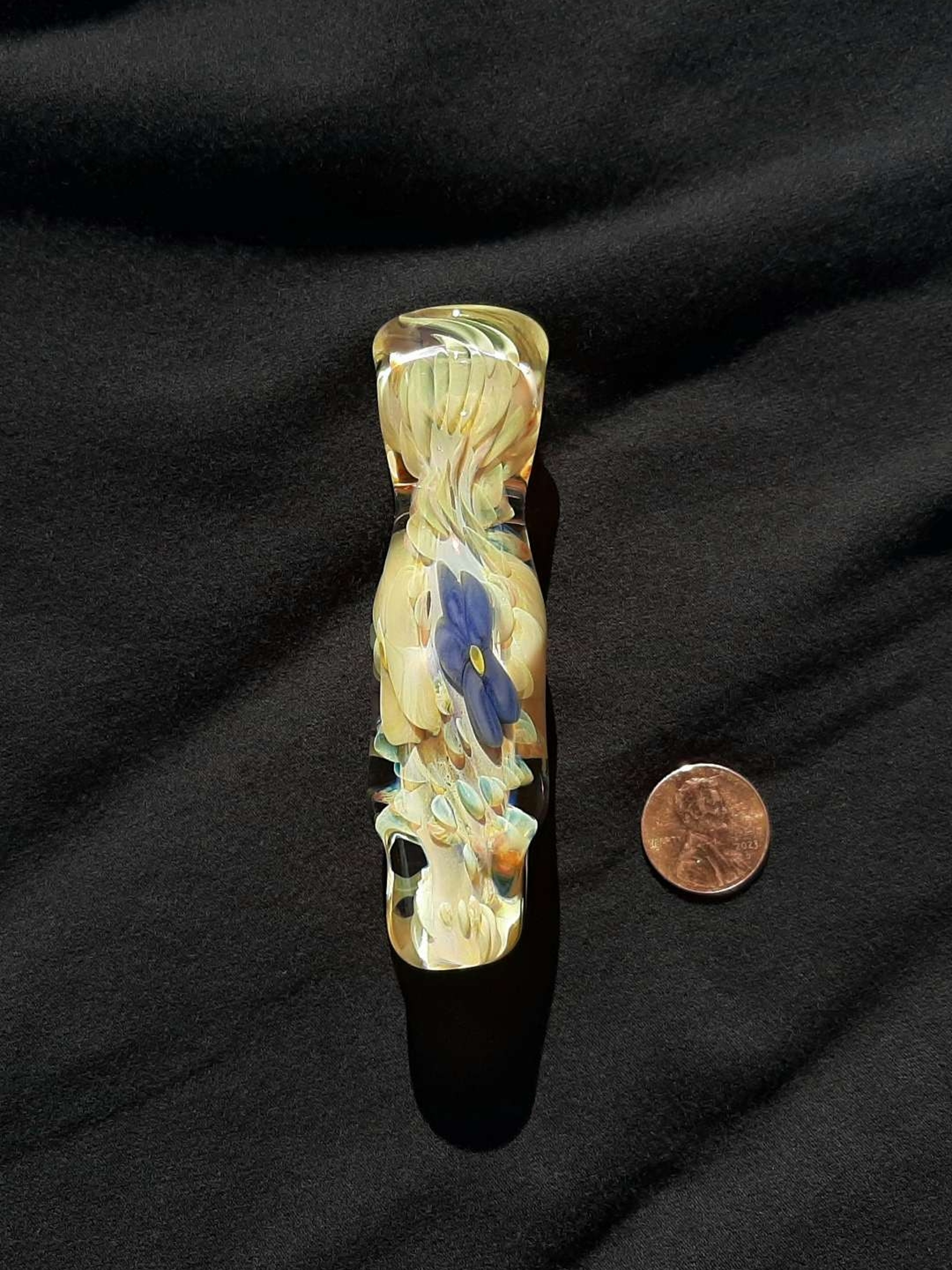 Preview pic of Inside out, flowers, color changing, borosilicate glass flower chillum with a flattened mouth.