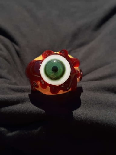 Preview pic of Inside out, color changing, bloody, glow in the dark, eyeball borosilicate glass pipe