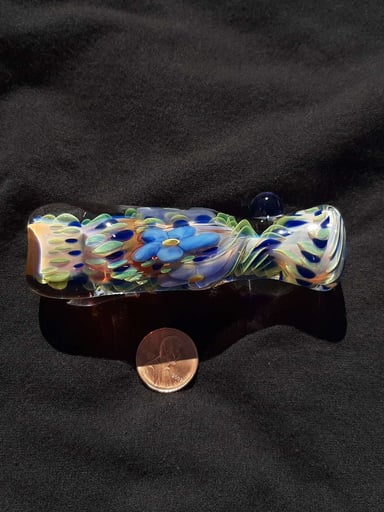 Preview pic of Inside out, color changing, borosilicate glass flower chillum with a flattened mouth