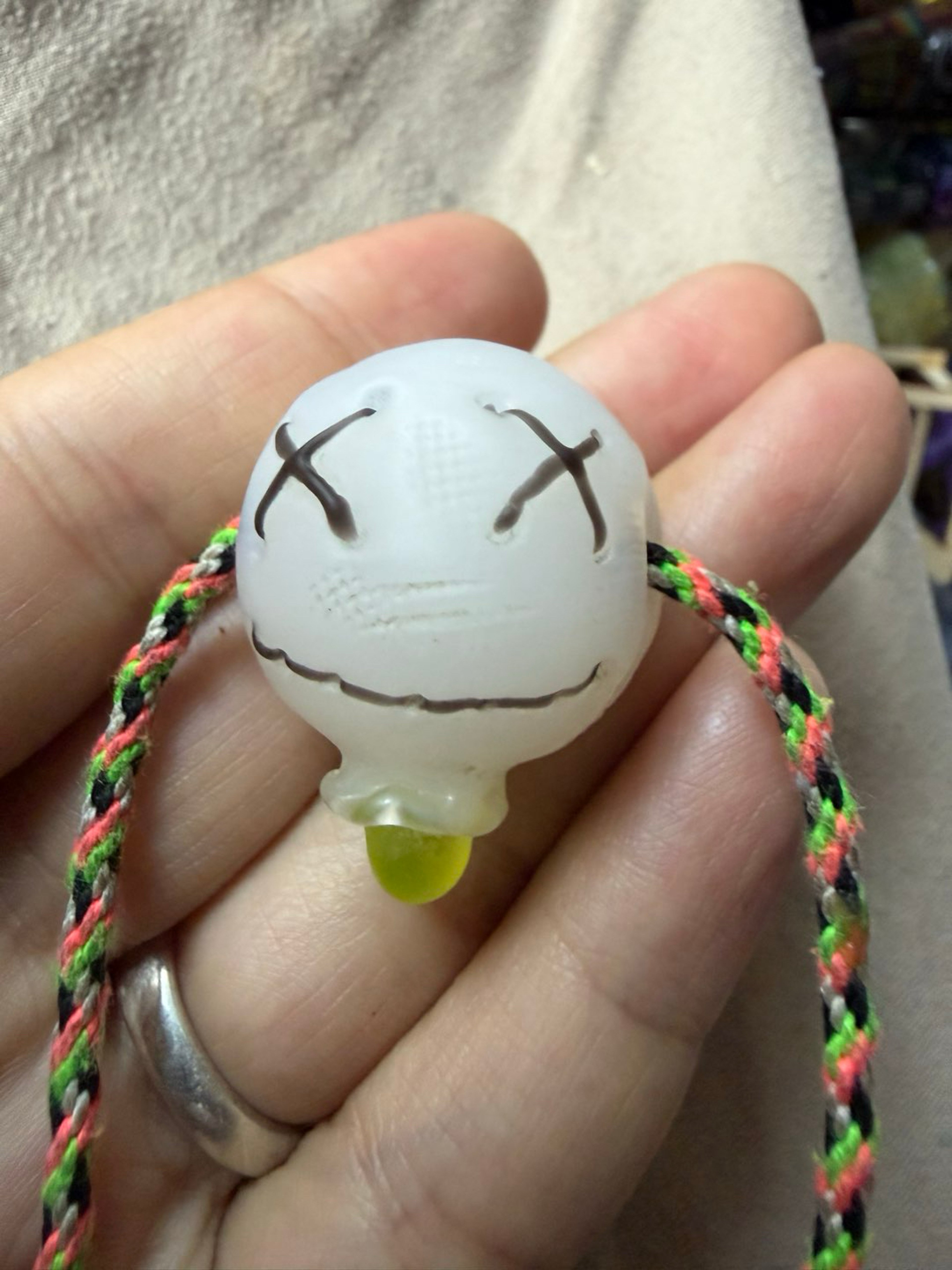 Muller Shrunken Head Pendant -UV image 0