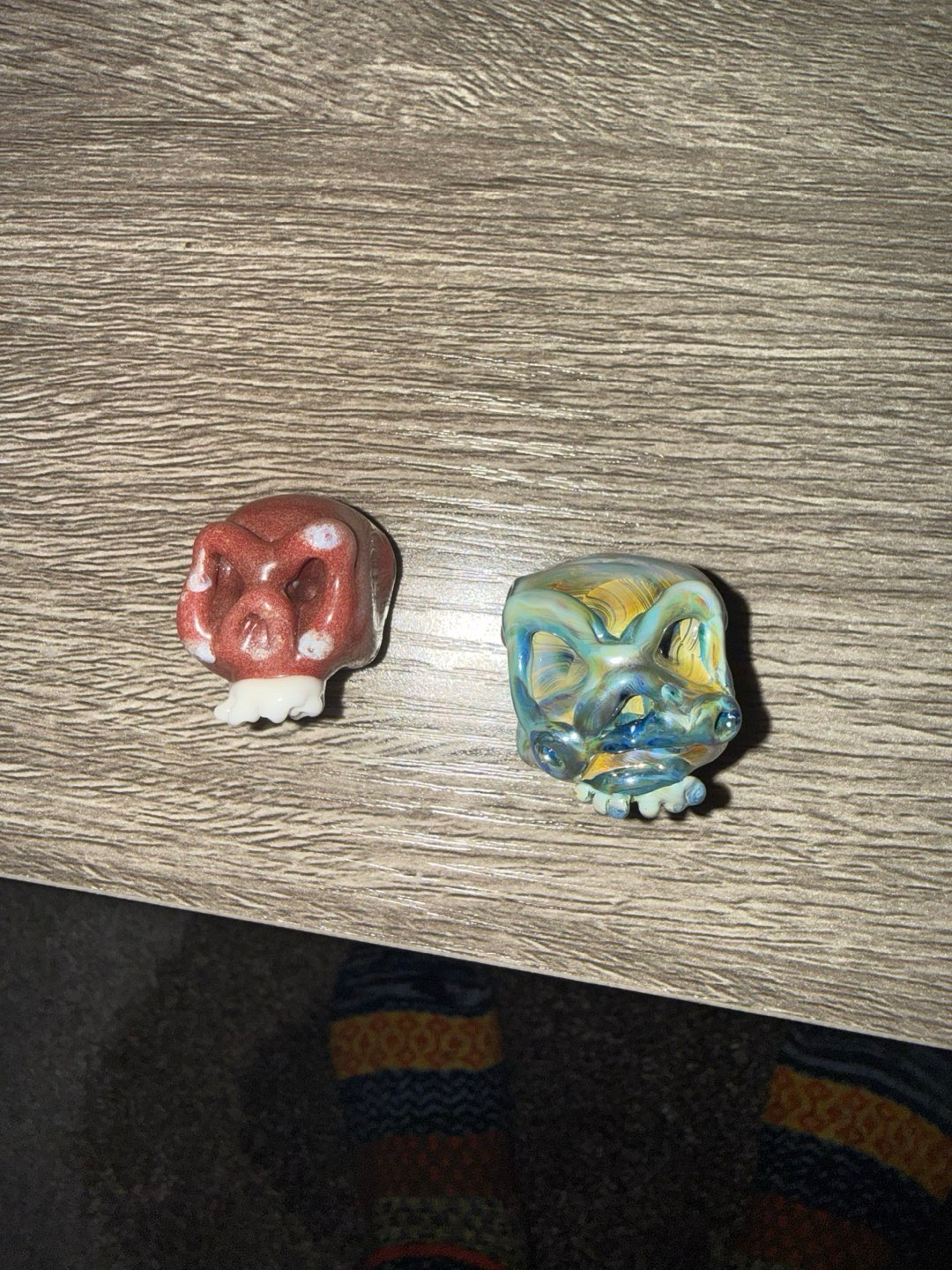 Pair of hollow glass skull pendants image 0