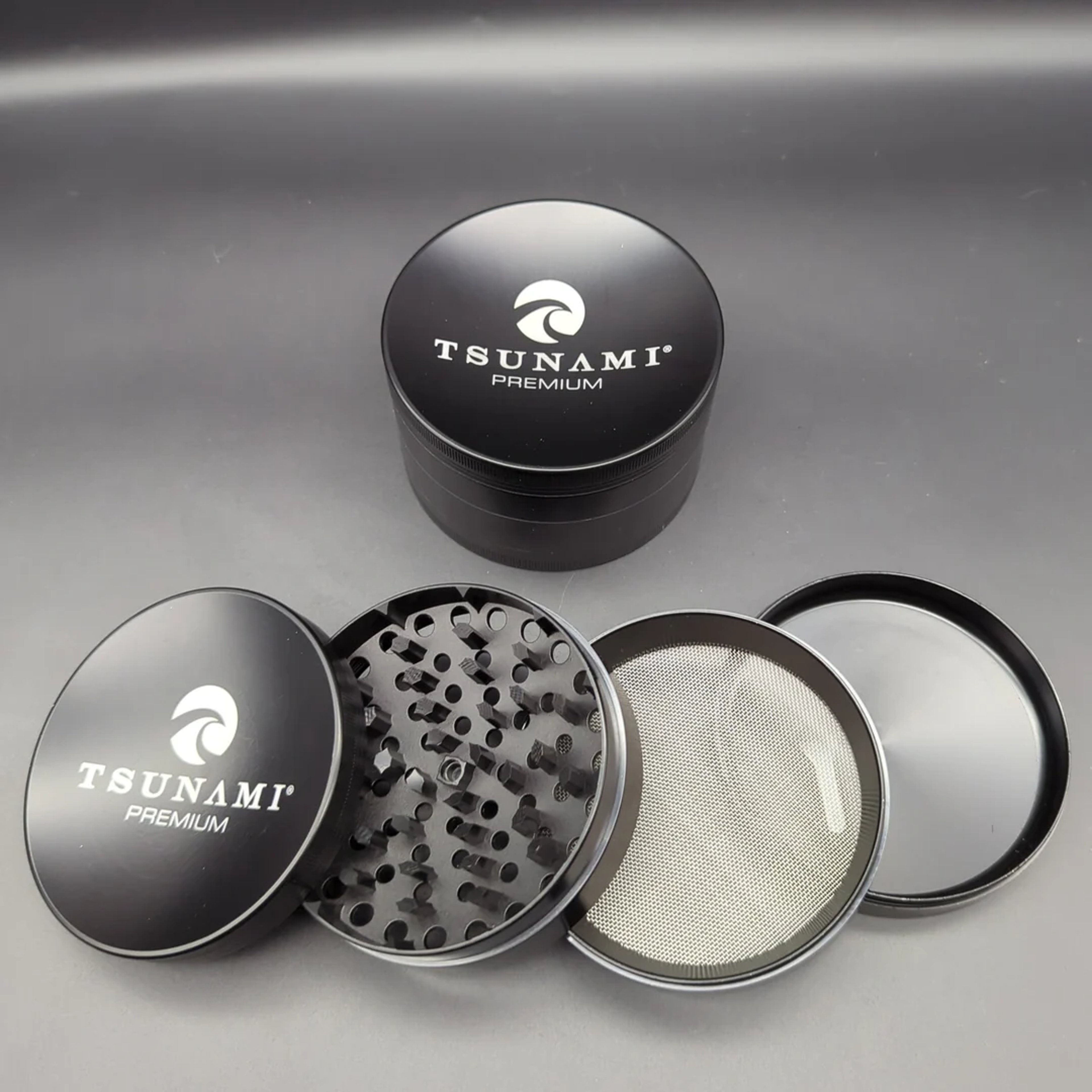 Preview pic of TSUNAMI DRY HERB GRINDER 4 PIECE 100MM (XL)
