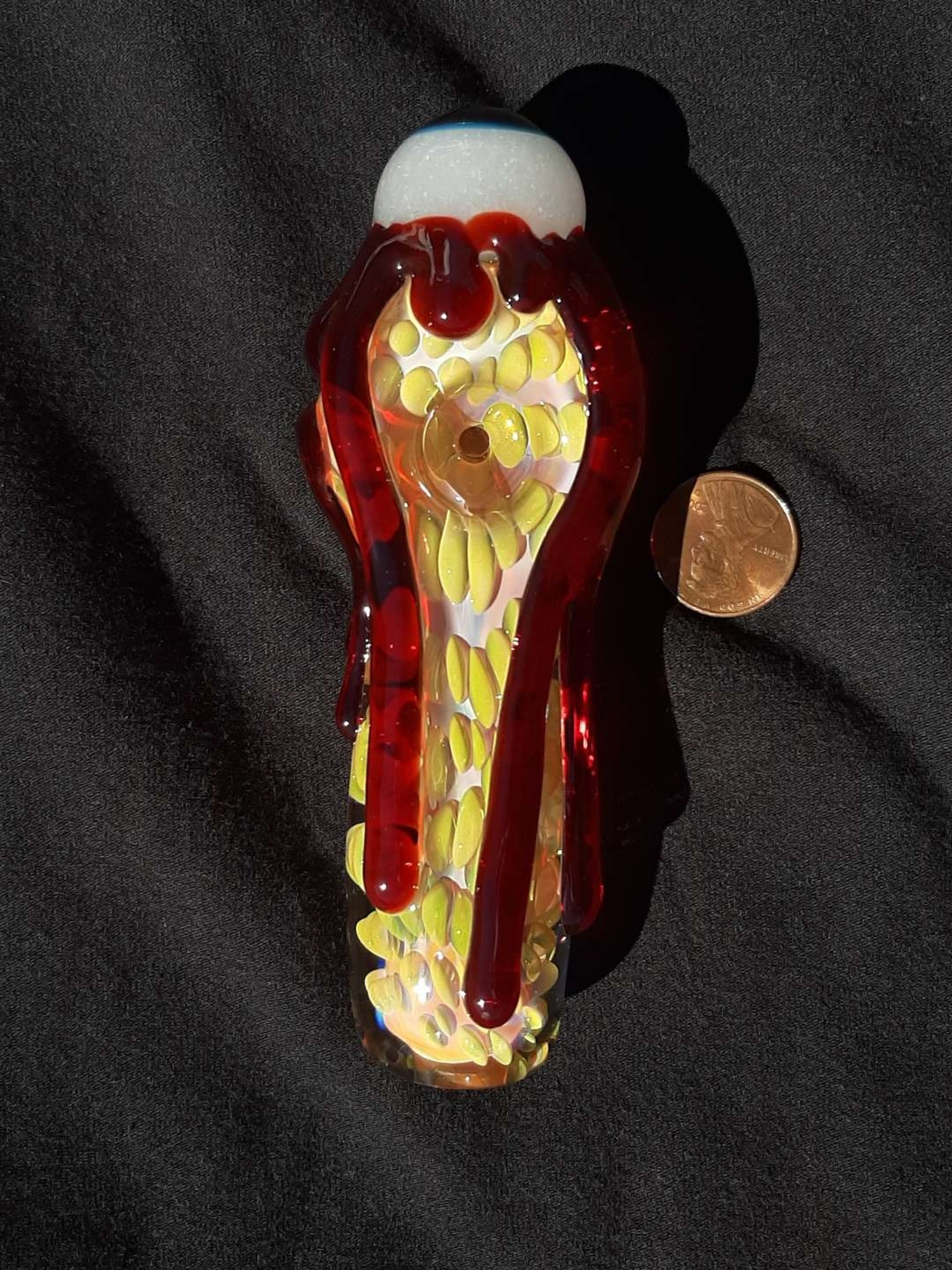 Preview pic of Inside out, color changing, bloody, glow in the dark eyeball, borosilicate glass pipe