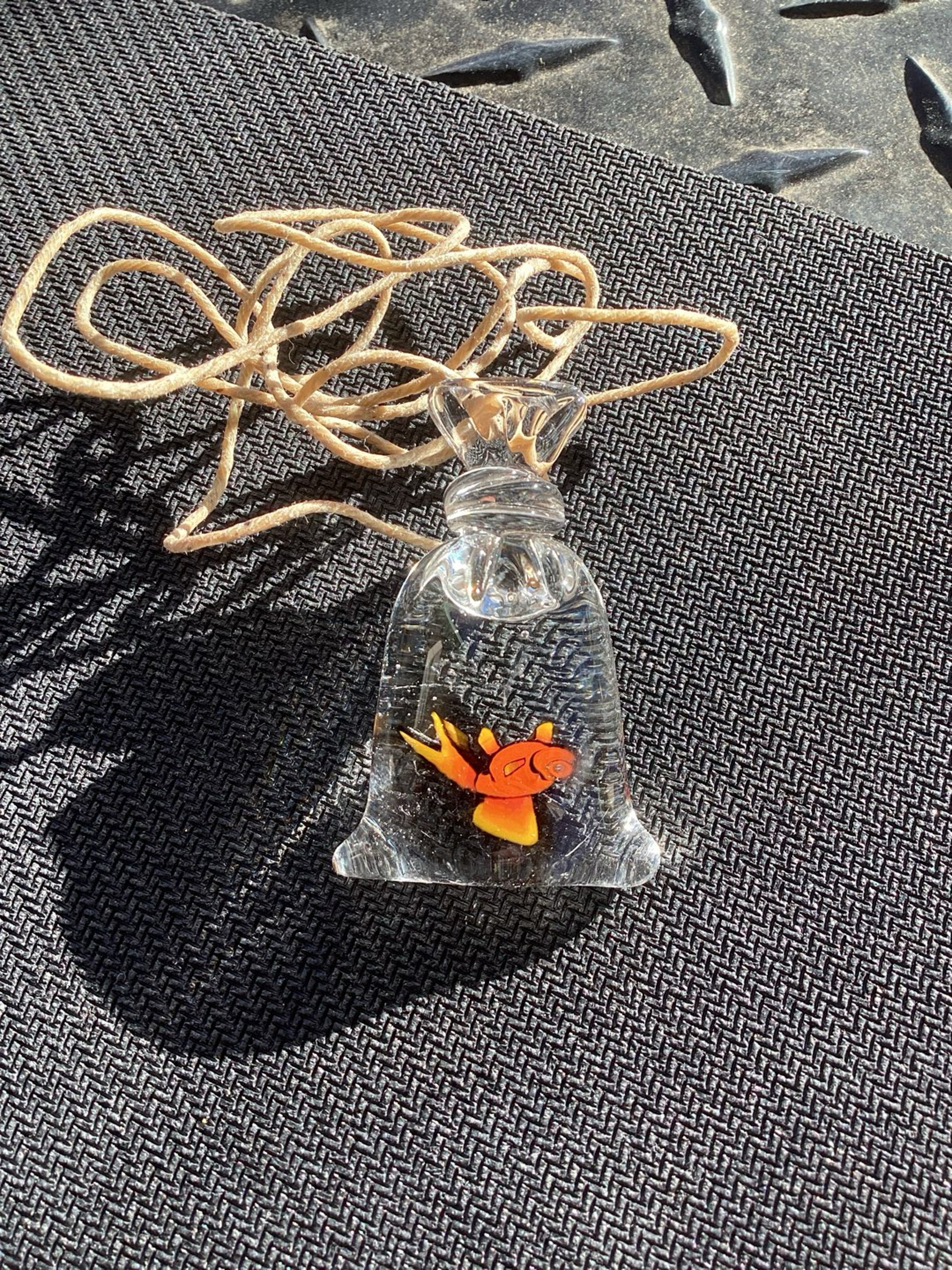 Preview pic of JKelly glass dead goldfish in amusement park bag with hemp necklace