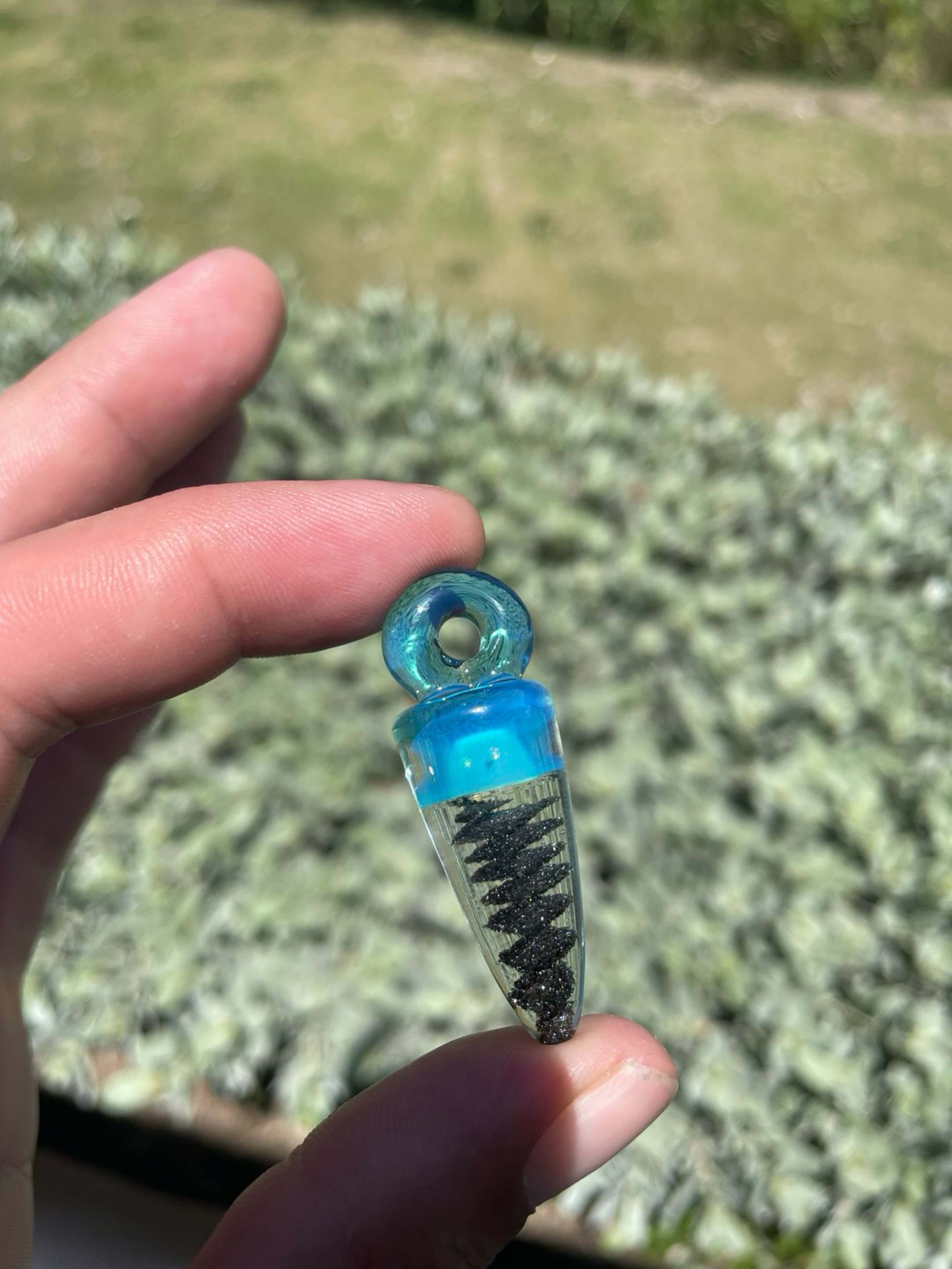 Preview pic of Encased black sand energy spiral pendant