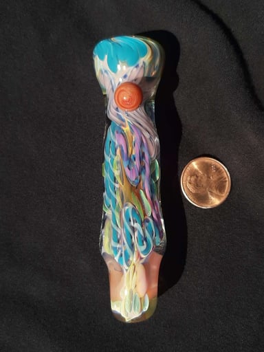 Preview pic of Inside out, color changing, borosilicate glass chillum with a flattened mouth