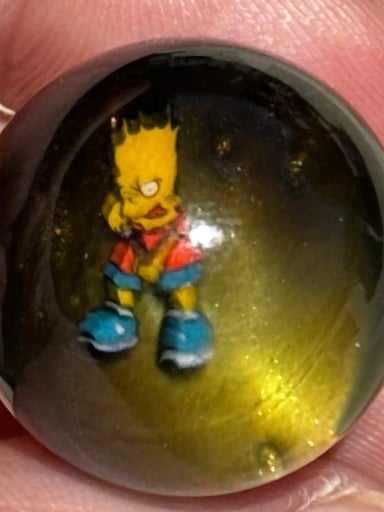 Preview pic of Keys Glass Slingshot Bart Simpson Marble