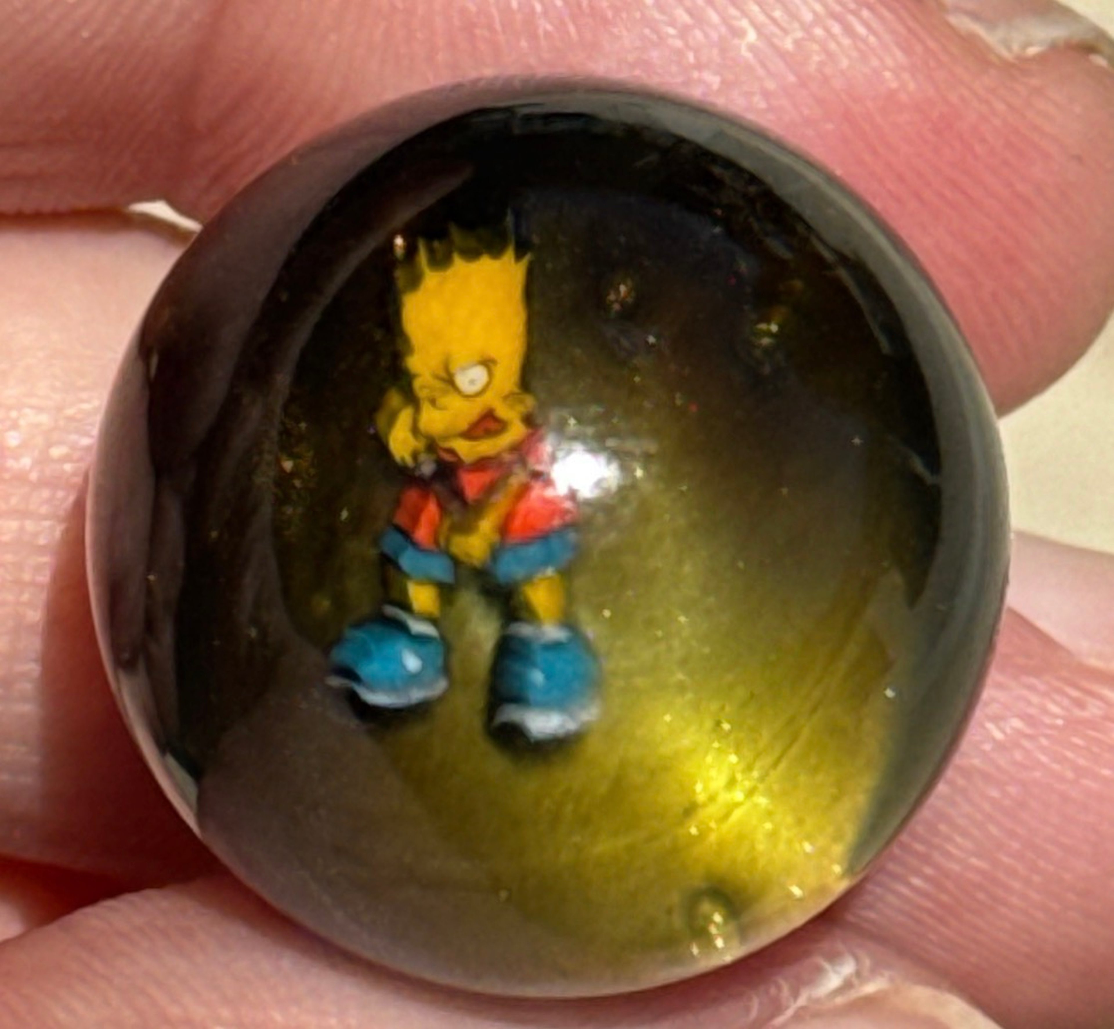 Preview pic of Keys Glass Slingshot Bart Simpson Marble