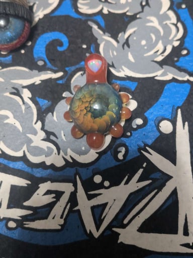 Preview pic of Gum glass layered implosion pendant with hot sauce accents