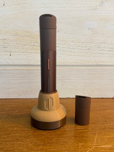 Preview pic of Puffco pivot in mocha with wireless charging base and extra silicone mouth piece